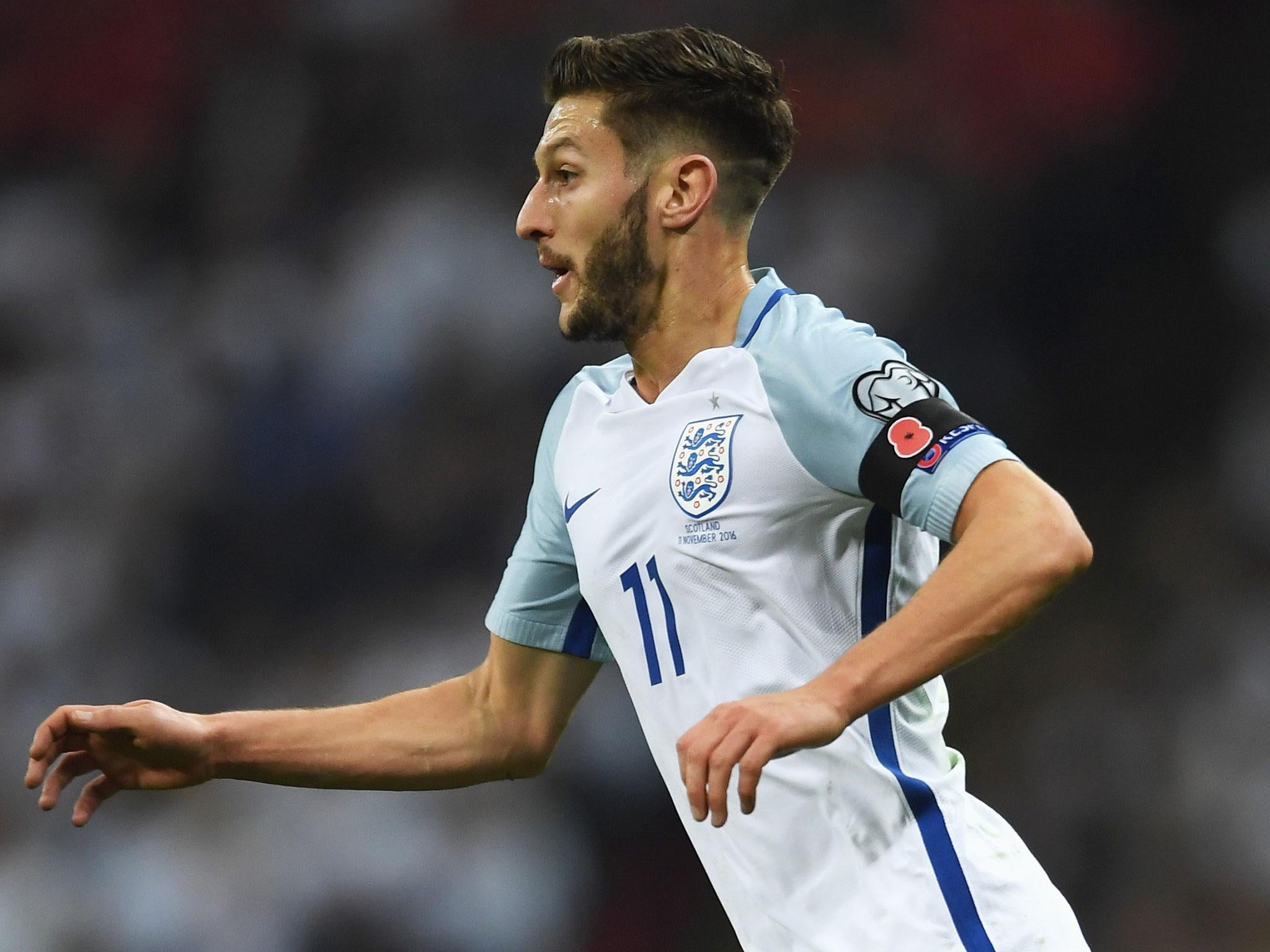 Adam Lallana sports a poppy on a black armband during England's 3-0 victory over Scotland