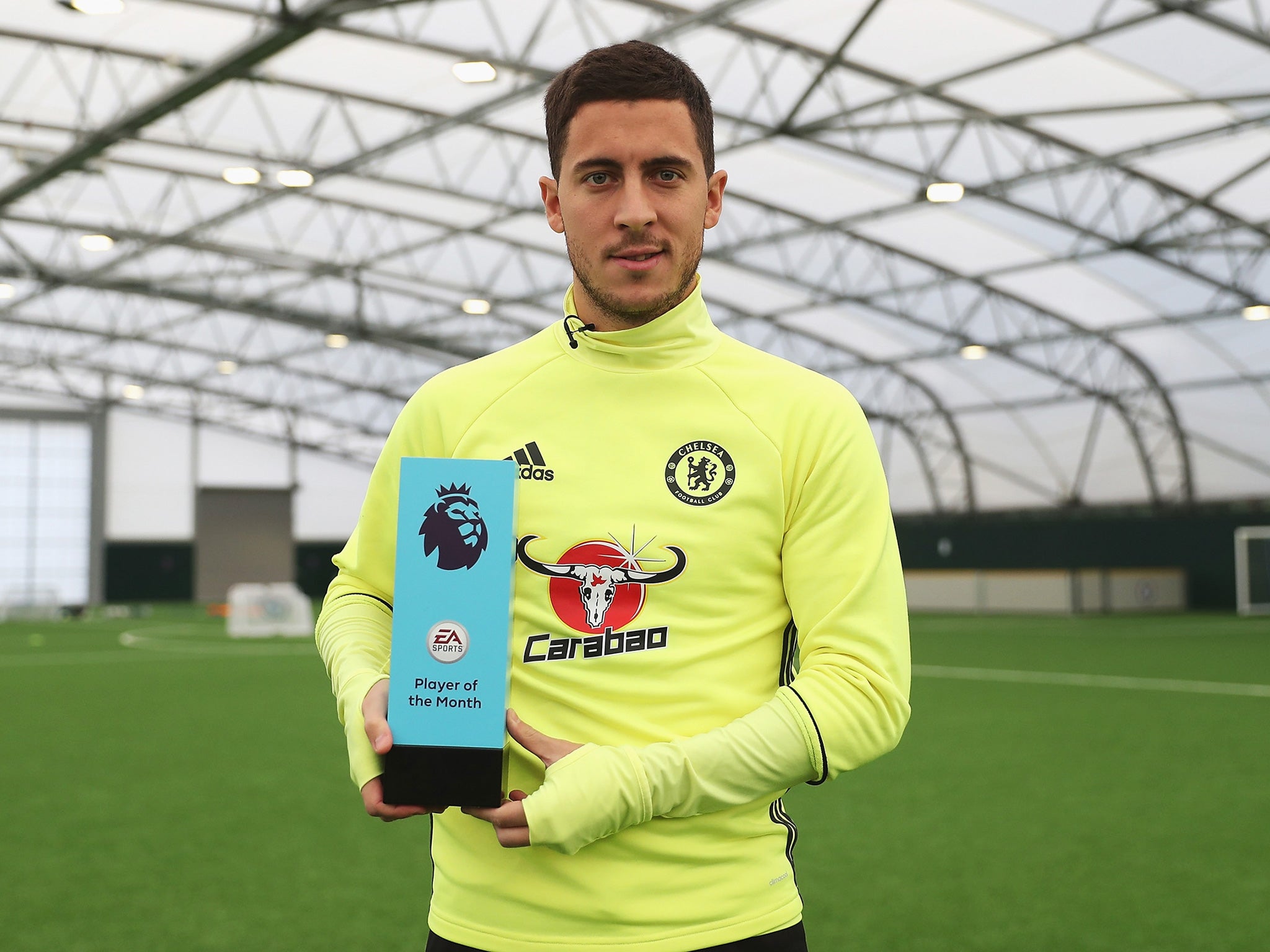 Hazard poses with his Premier League 'Player of the Month' award for October