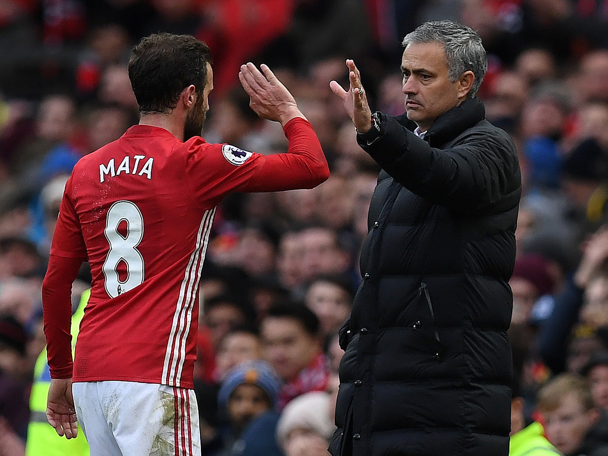 Mata is congratulated by Mourinho on his goal