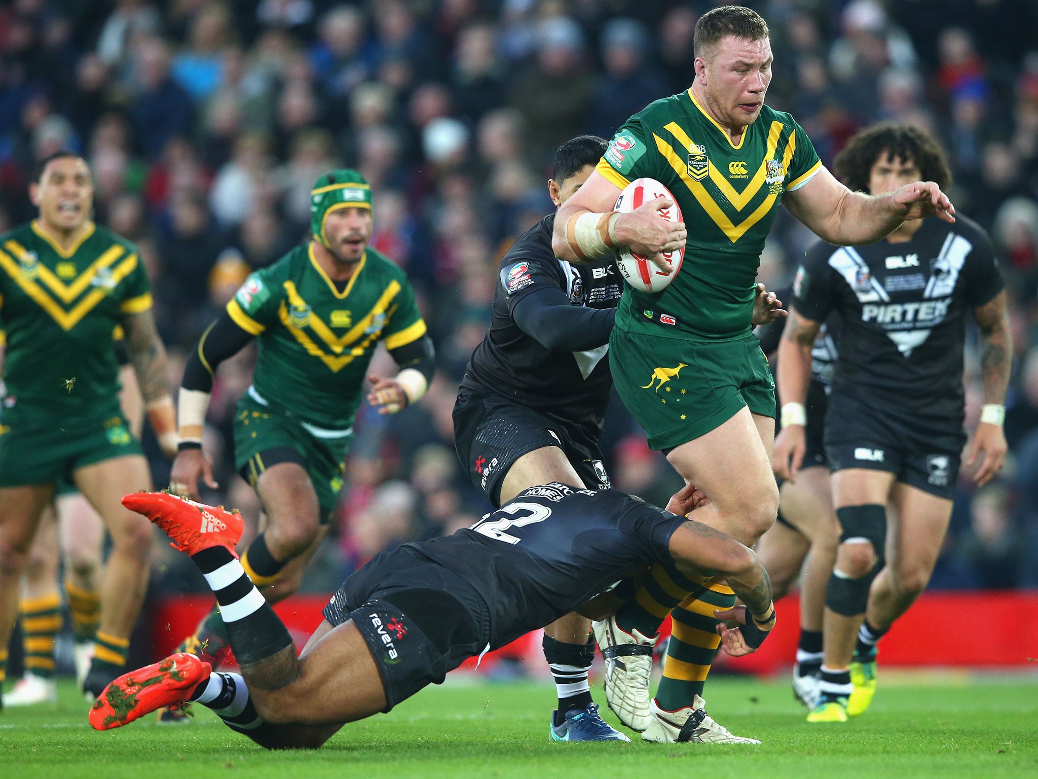 Shannon Boyd of Australia tries to break free of Manu Ma'u's tackle during the Four Nations Final