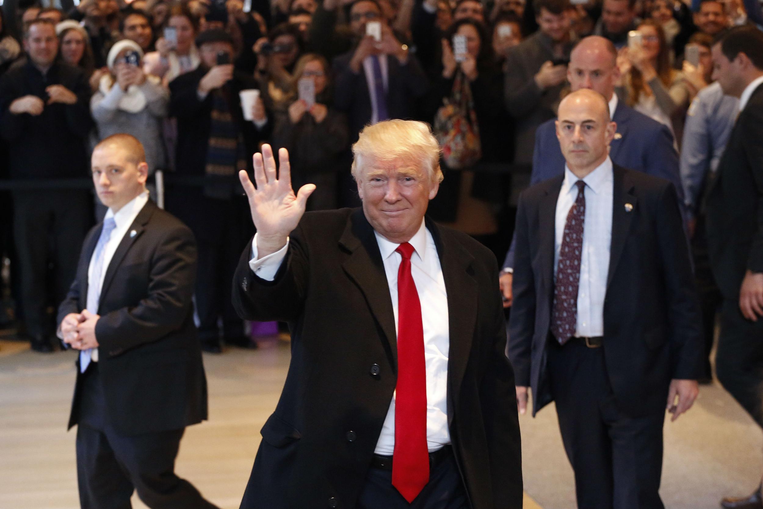 Mr Trump received cheers and boos when he visited the newspaper