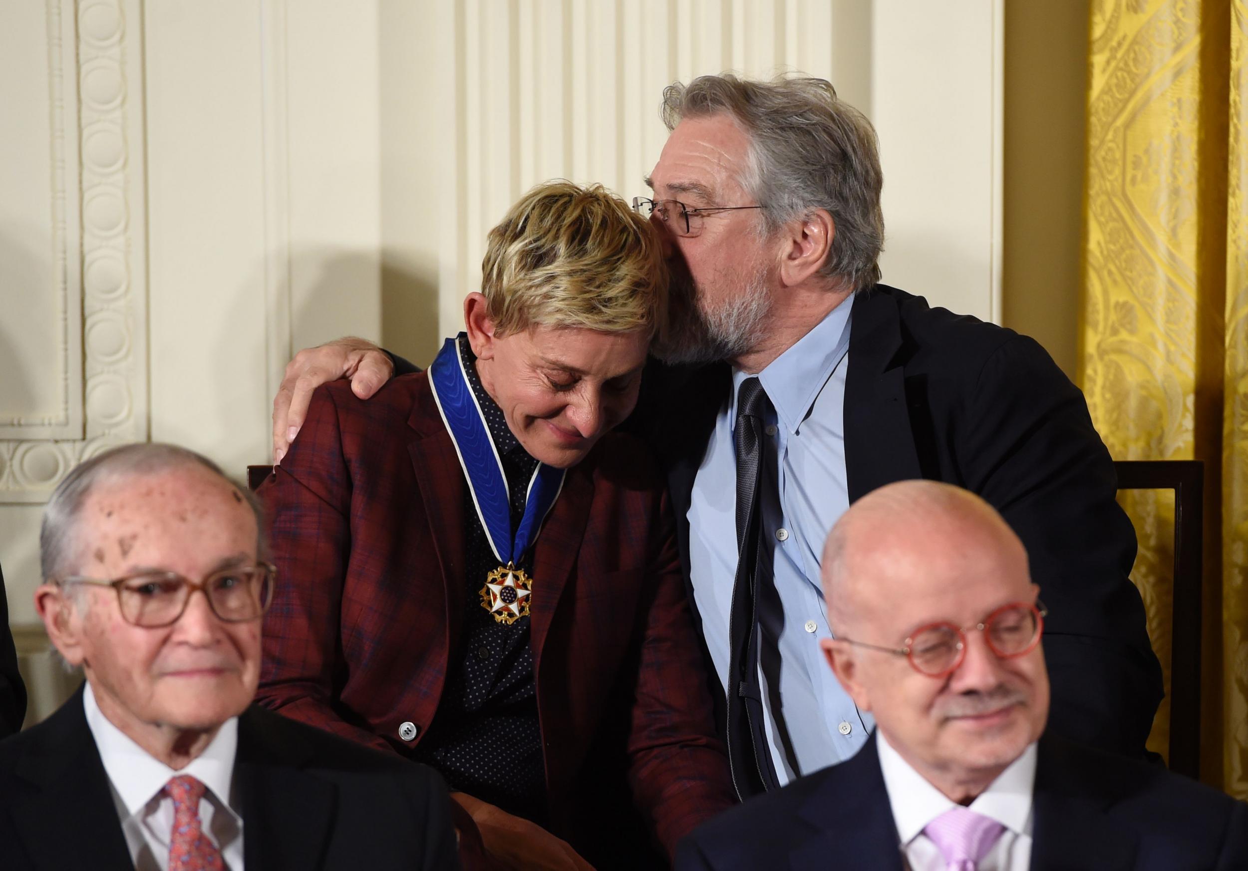 Robert De Niro comforts Ellen DeGeneres after she becomes emotional accepting her medal