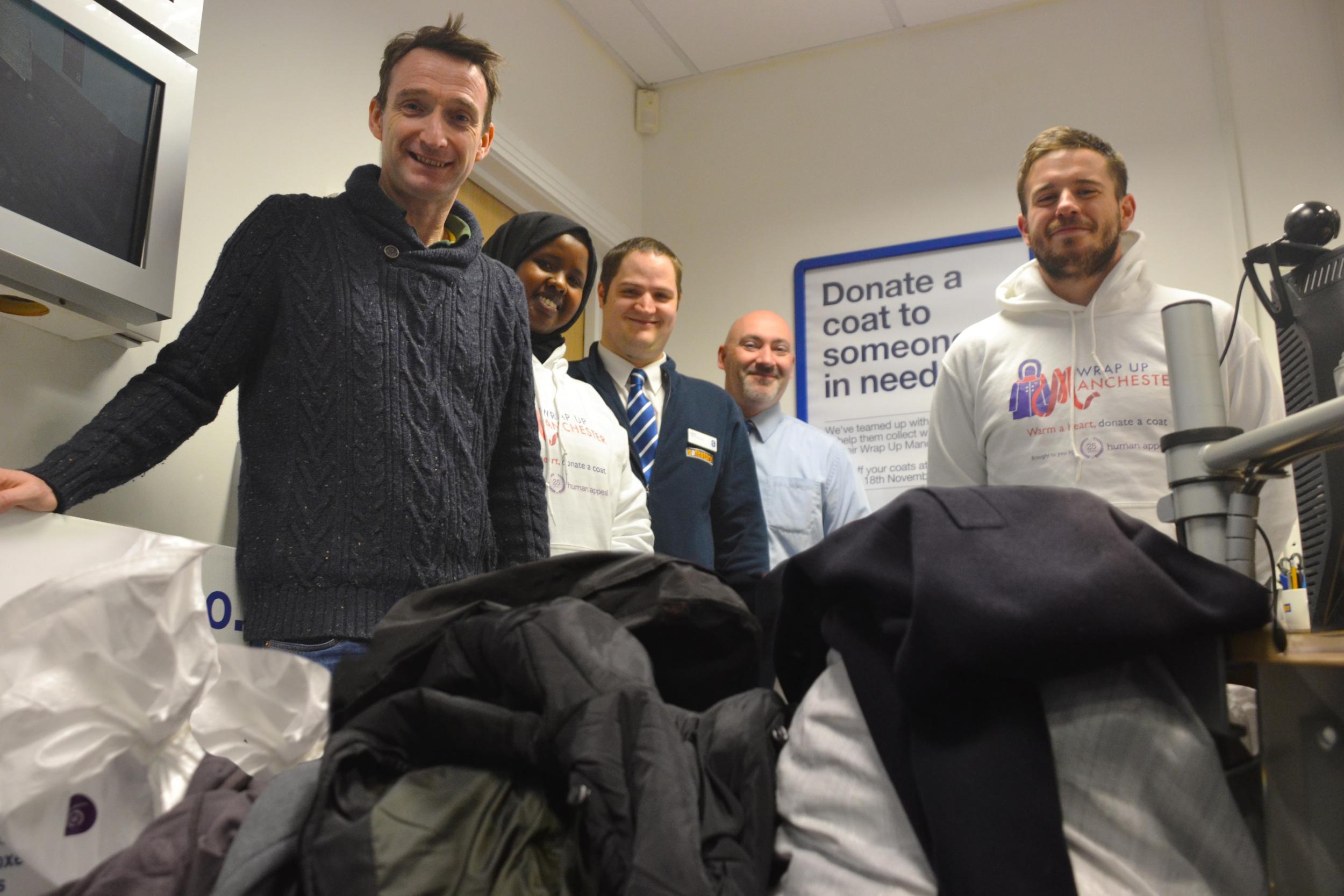 John Leech (left), Liberal Democrat MP for Manchester Withington, joined the volunteers in sorting through the donations