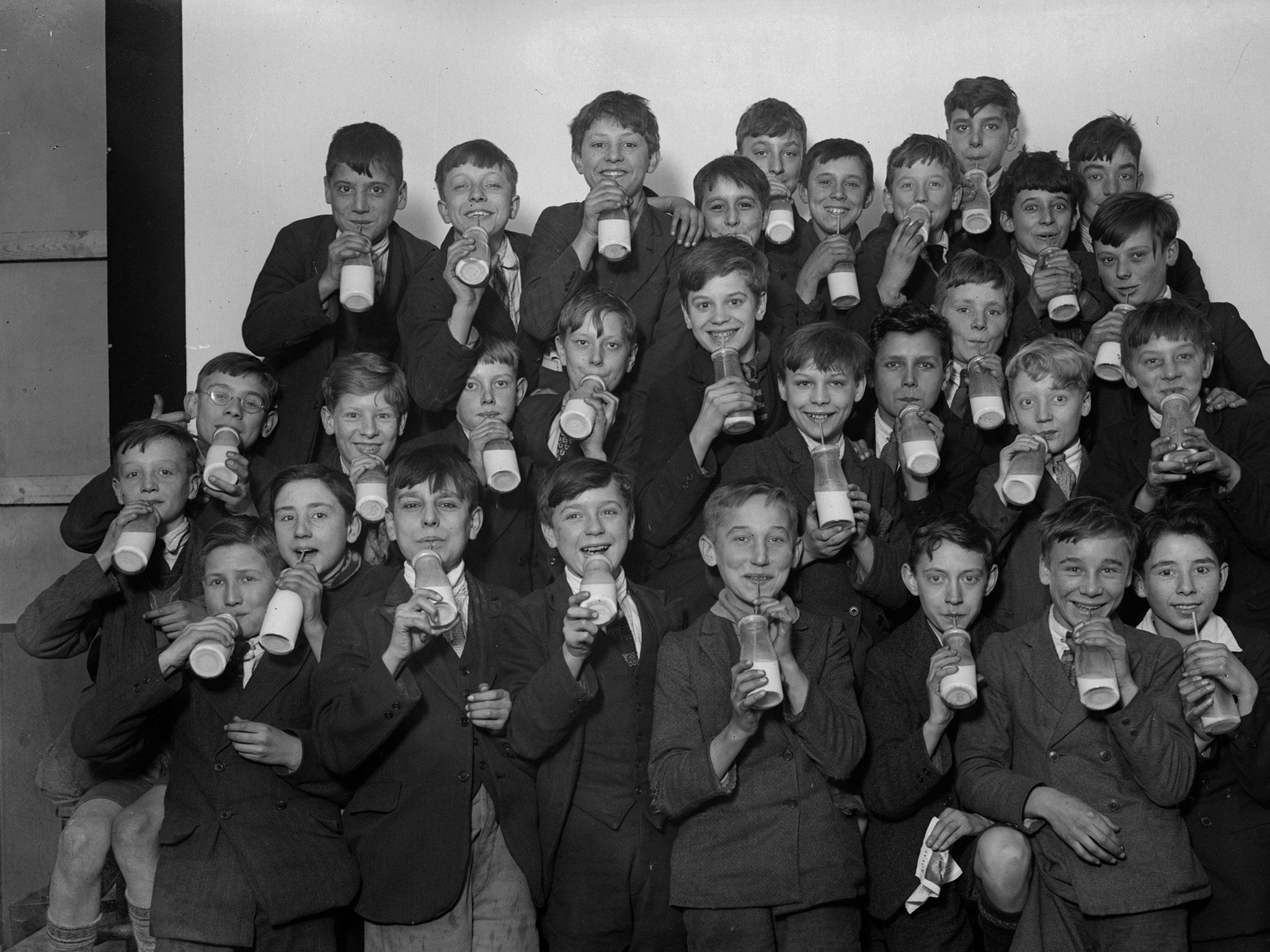 Schoolboys enjoy milk in the London borough of Southwark.