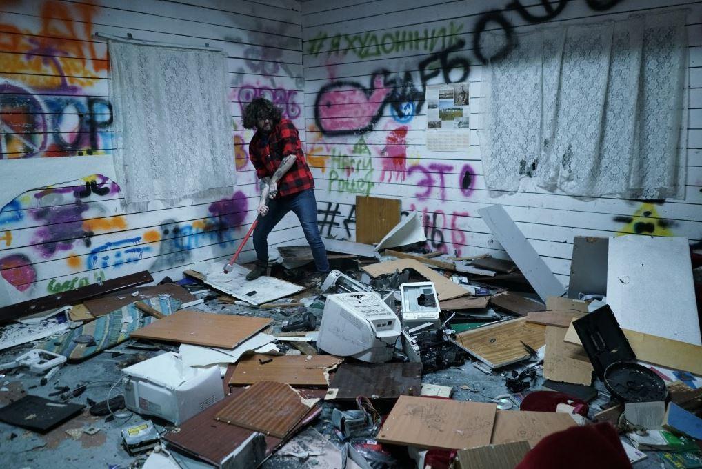 Alan Tigiev takes out his frustrations on some office equipment with a sledgehammer at a converted former secret military factory where people pay to destroy unwanted donated goods. Much of the proceeds go to charity