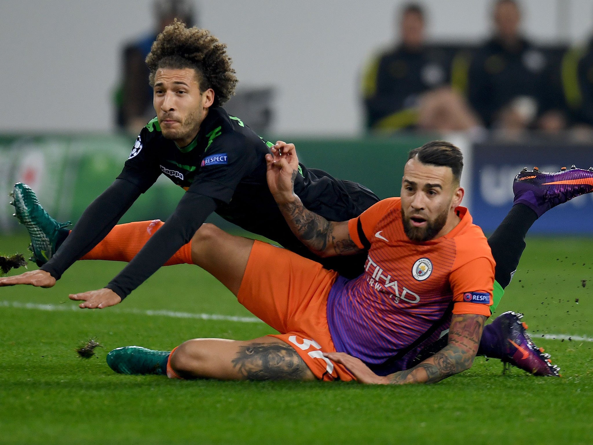 City's Otamendi slides in on Monchengladbach's Johnson