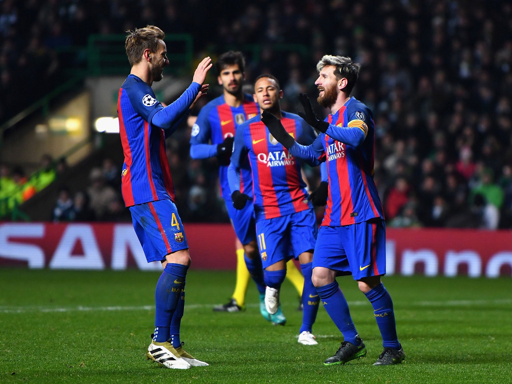 Lionel Messi of Barcelona (R) celebrates scoring his side's second goal with Ivan Rakitic of Barcelona