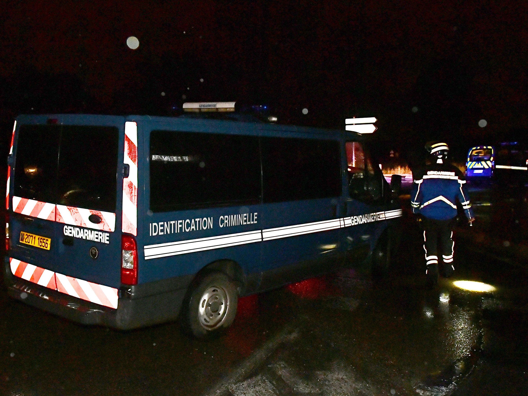 Gendarmes stand guard near a retirement home in Montferrier-sur-Lez, France, following an attack on 24 November