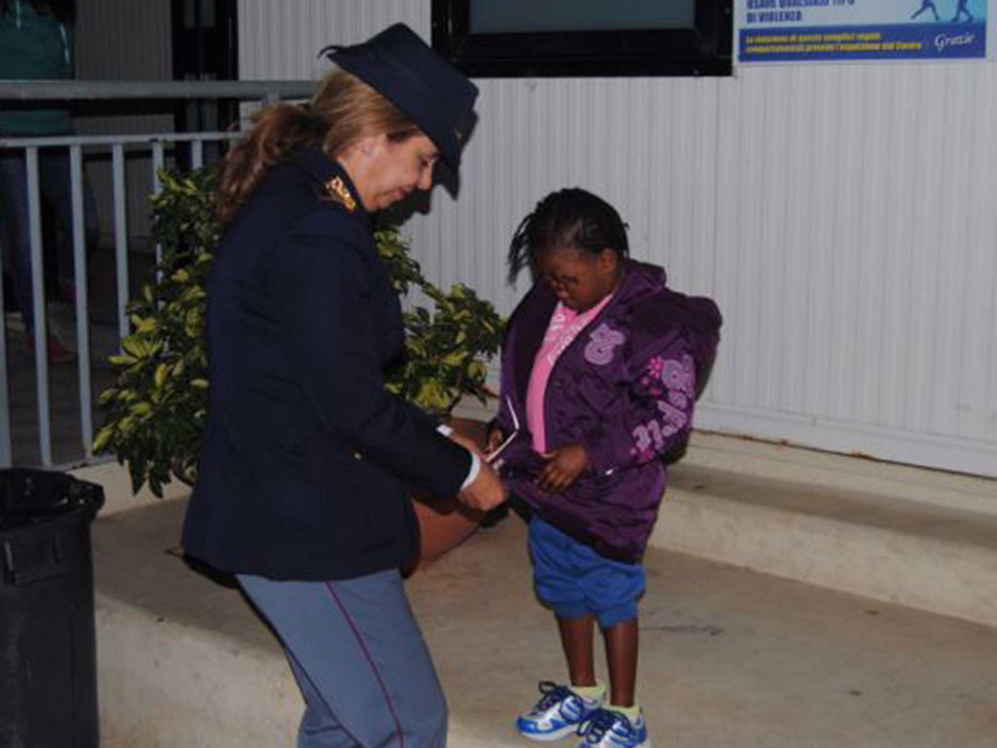 Police officer Maria Volpe taking care of Oumoh