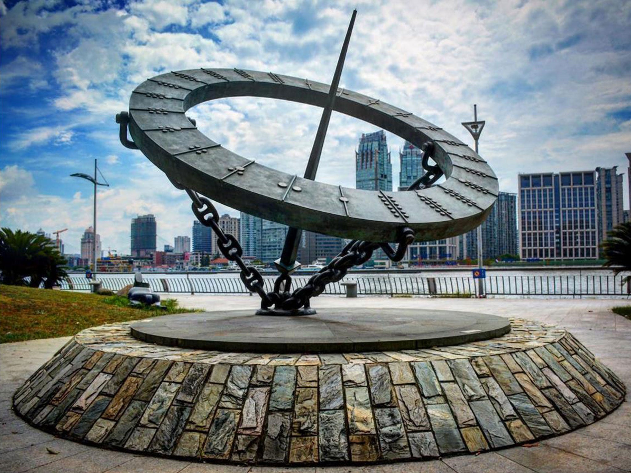 A sculpture resembling Wendy Taylor CBE's sculpture Timepiece alongside the Huangpu River in Shanghai