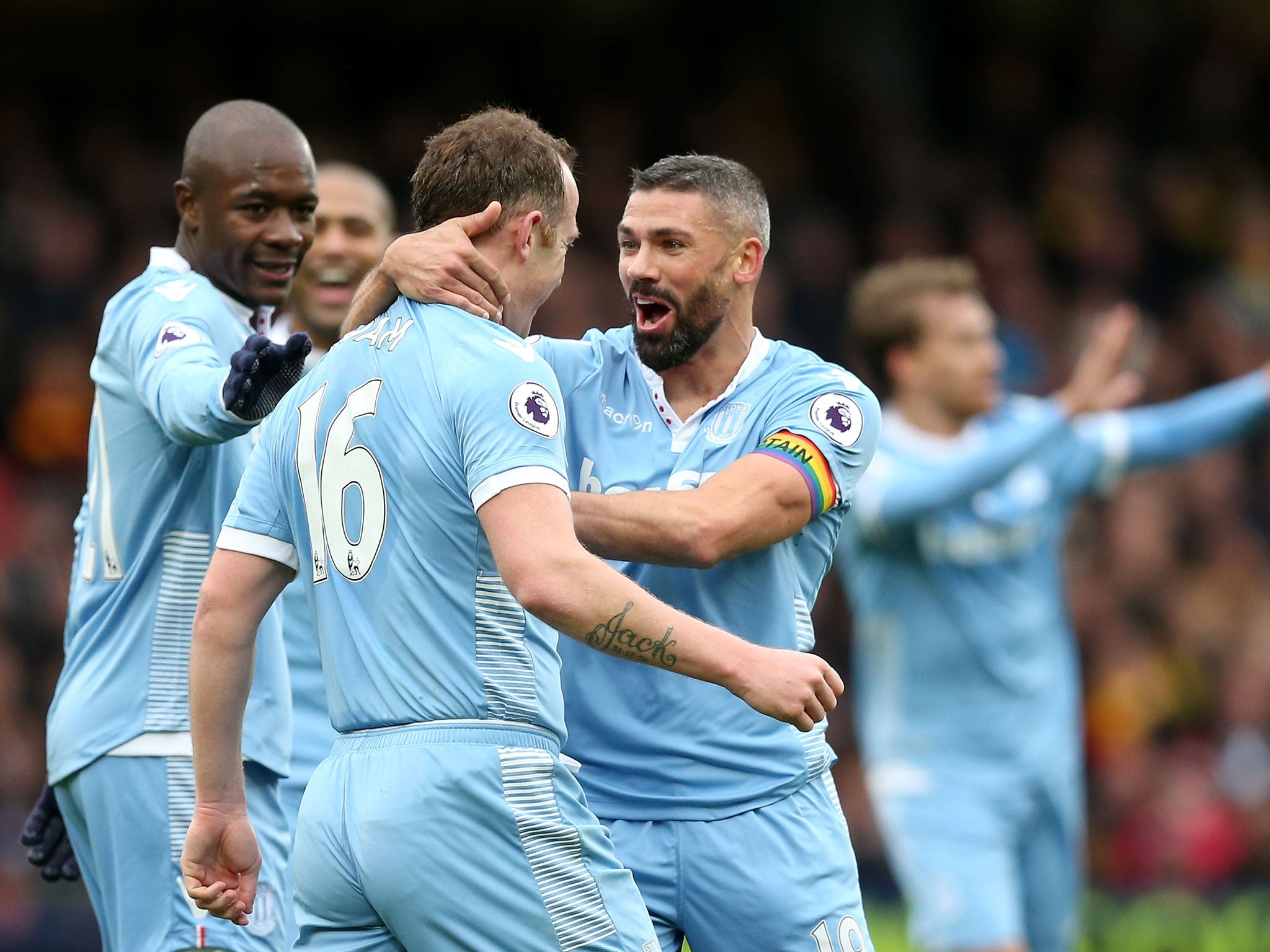 Jonathan Walters celebrates with Charlie Adam after the player's headed attempt helped put Stoke ahead courtesy of a Gomes deflection