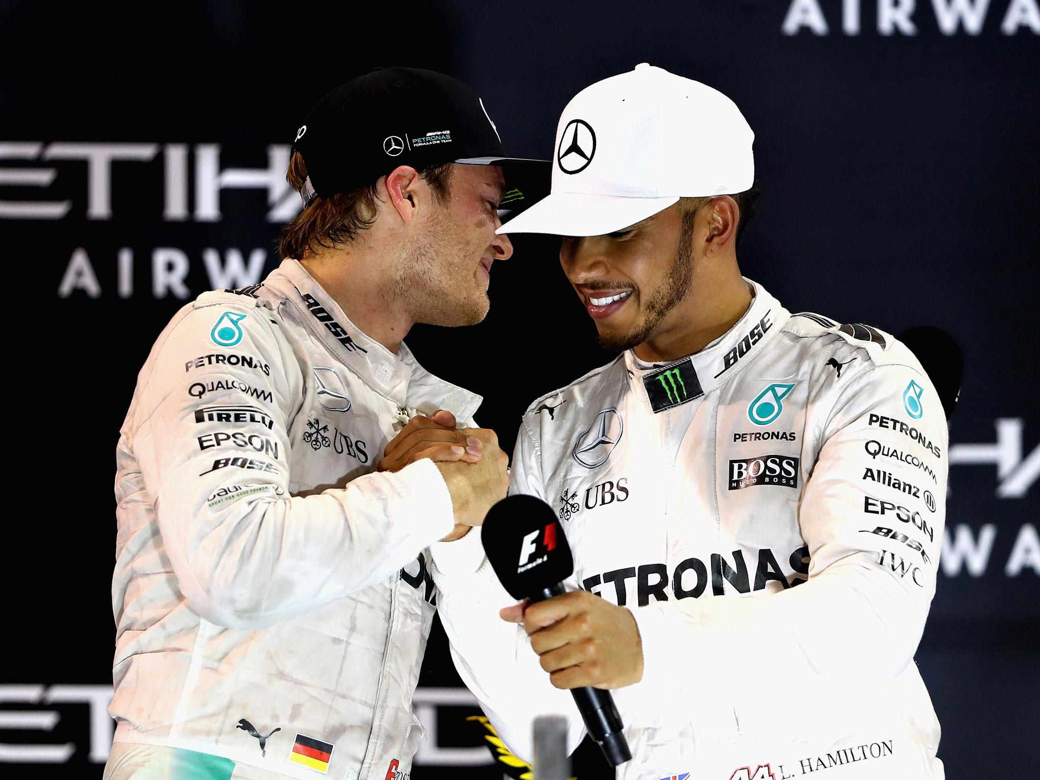 Rosberg and Hamilton shakle hands after the Abu Dhabi Grand Prix