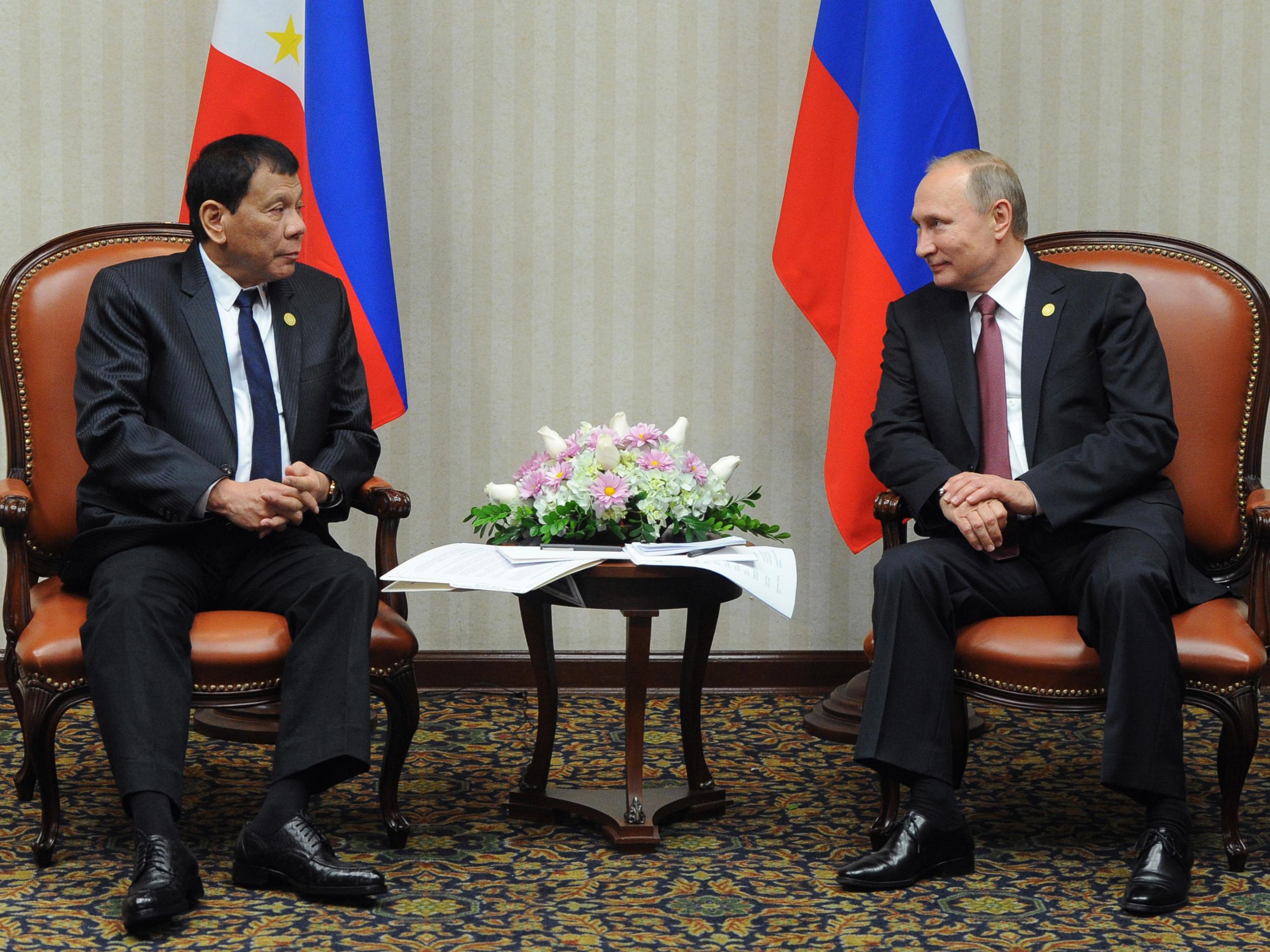 Russian President Vladimir Putin (R) meets with his Philippines' counterpart Rodrigo Duterte on the sidelines of the Asia-Pacific Economic Cooperation Summit (APEC) in Lima on November 19, 2016