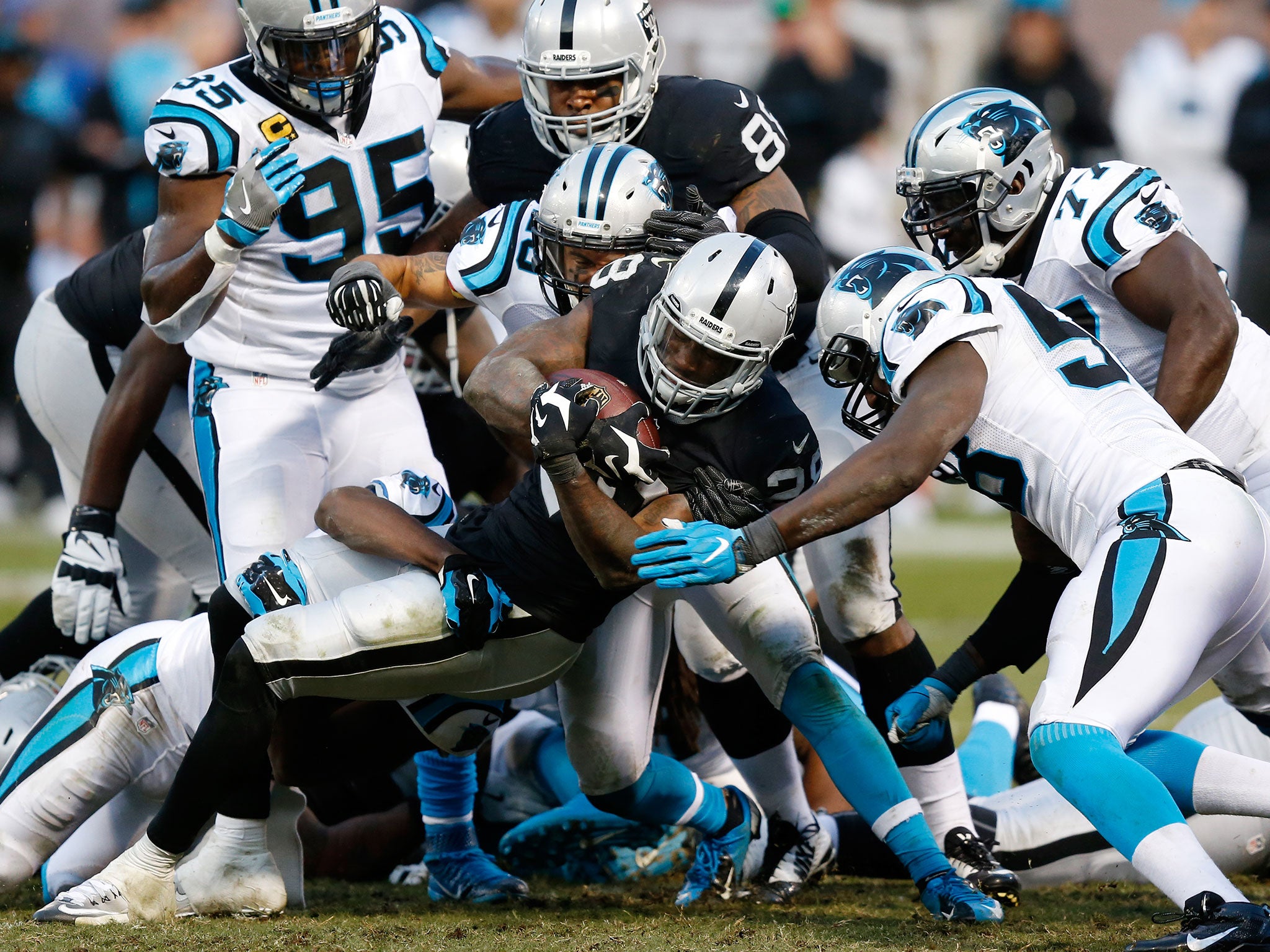 Latavius Murray of the Oakland Raiders rushes with the ball against the Carolina Panthers during their NFL game on November 27, 2016 in Oakland, California