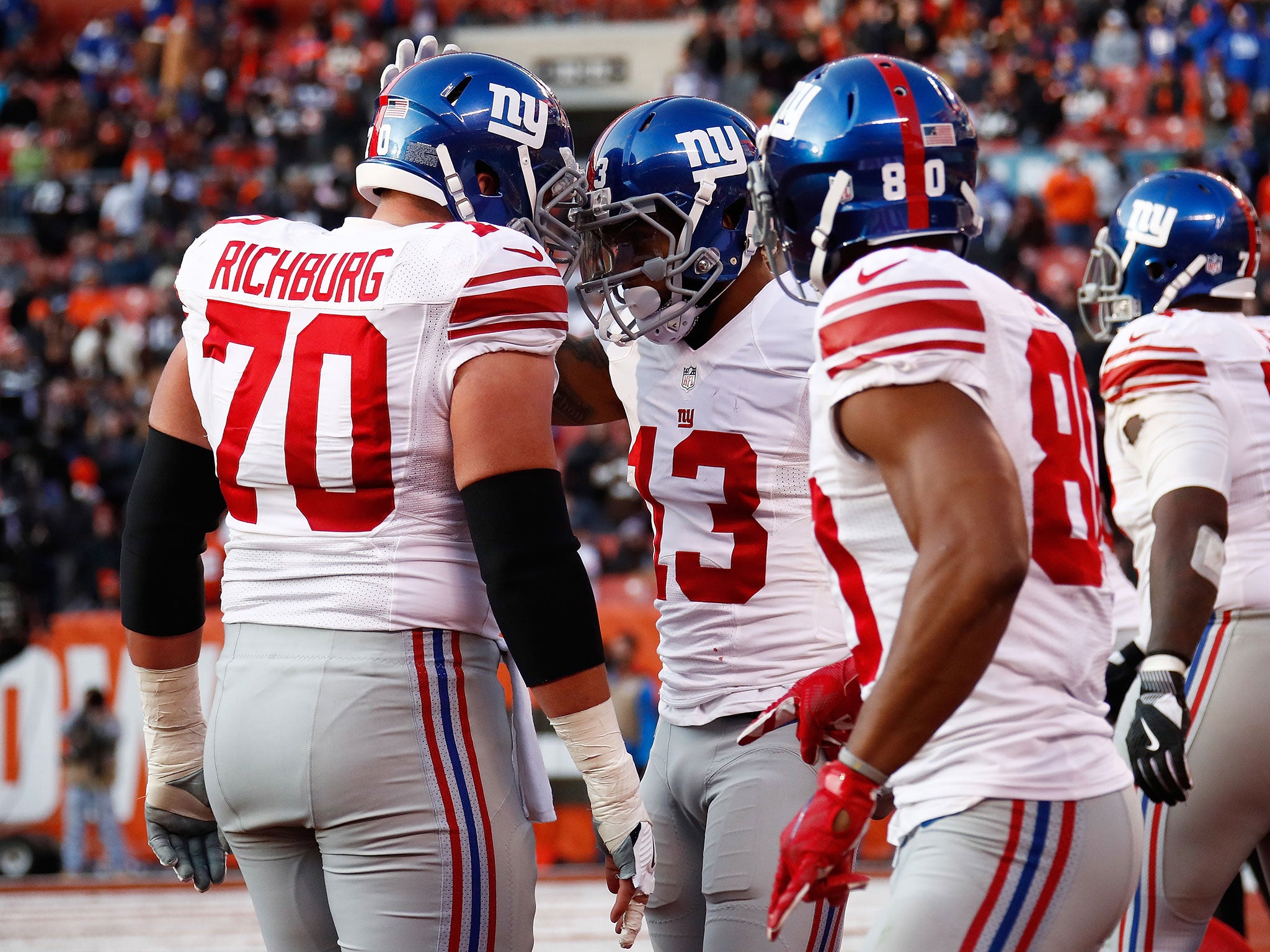 Odell Beckham #13 of the New York Giants celebrates his touchdown with Weston Richburg #70 during the fourth quarter against the Cleveland Browns at FirstEnergy Stadium