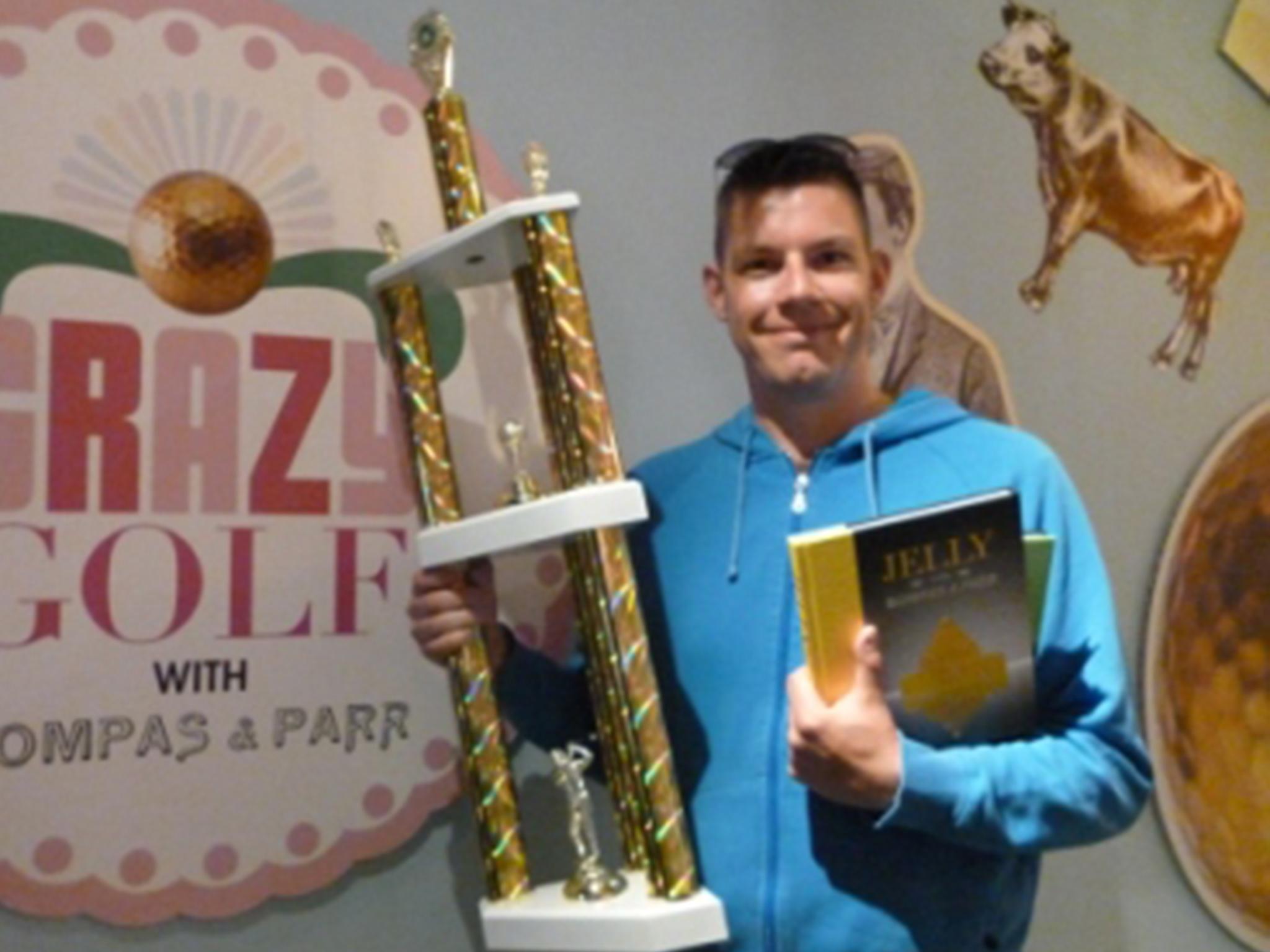 Richard Gottfried with his trophy at the Crazy Golf with Bompass &amp; Parr Championship playoff