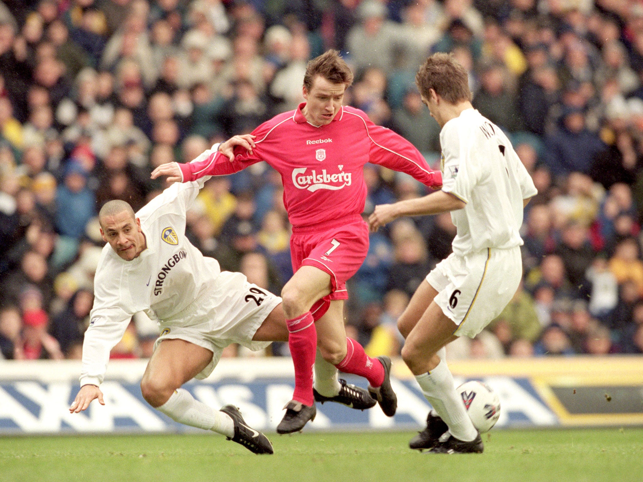 Vladimir Smicer of Liverpool clashes with Rio Ferdinand and Jonathan Woodgate of Leeds during their clash in the FA Cup fourth round match at Elland Road, Leeds, 27 January 2001