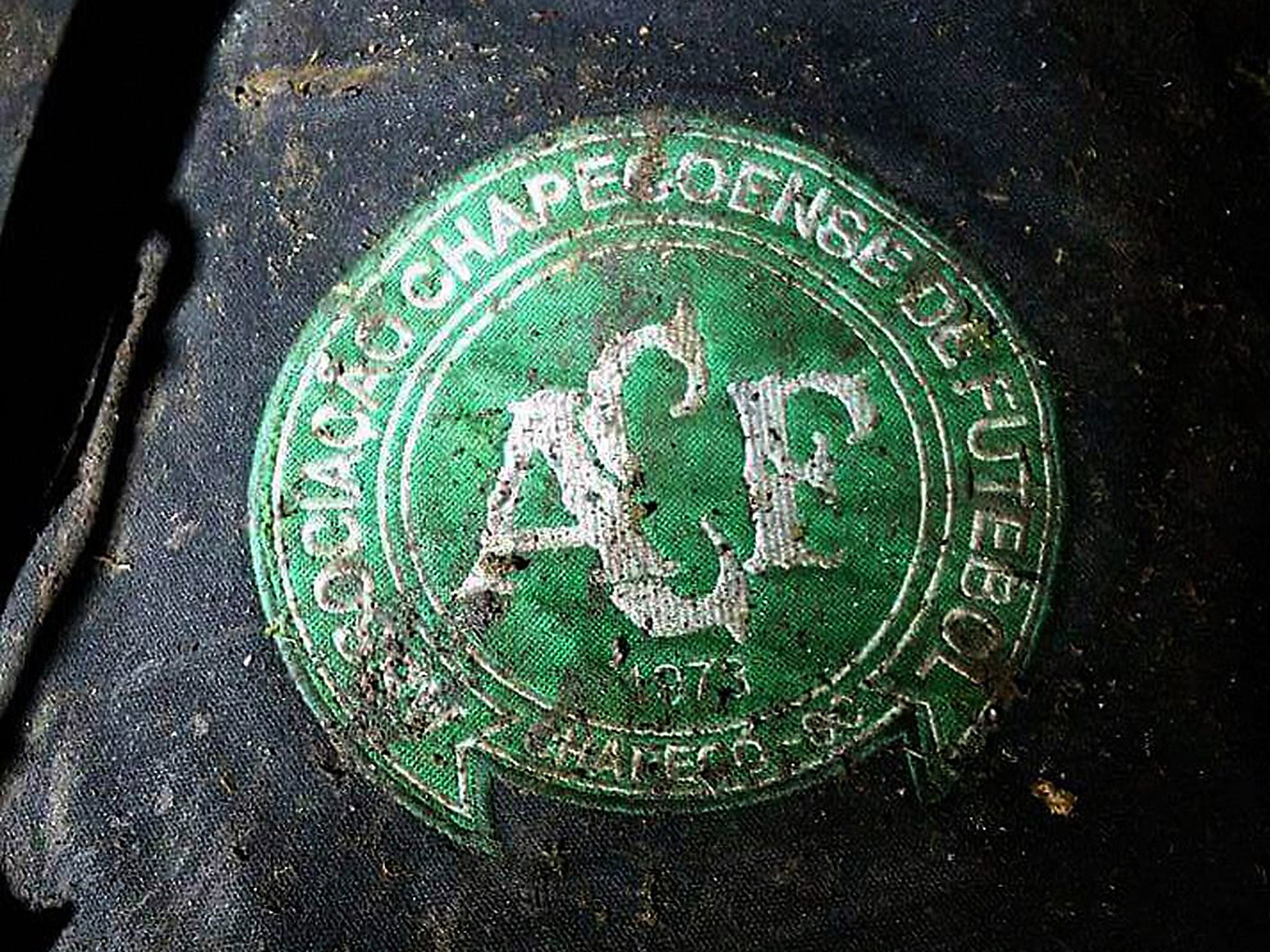 Logo of the Brazilian football team Chapeconese at the site of the plane crash near Medellin in Colombia