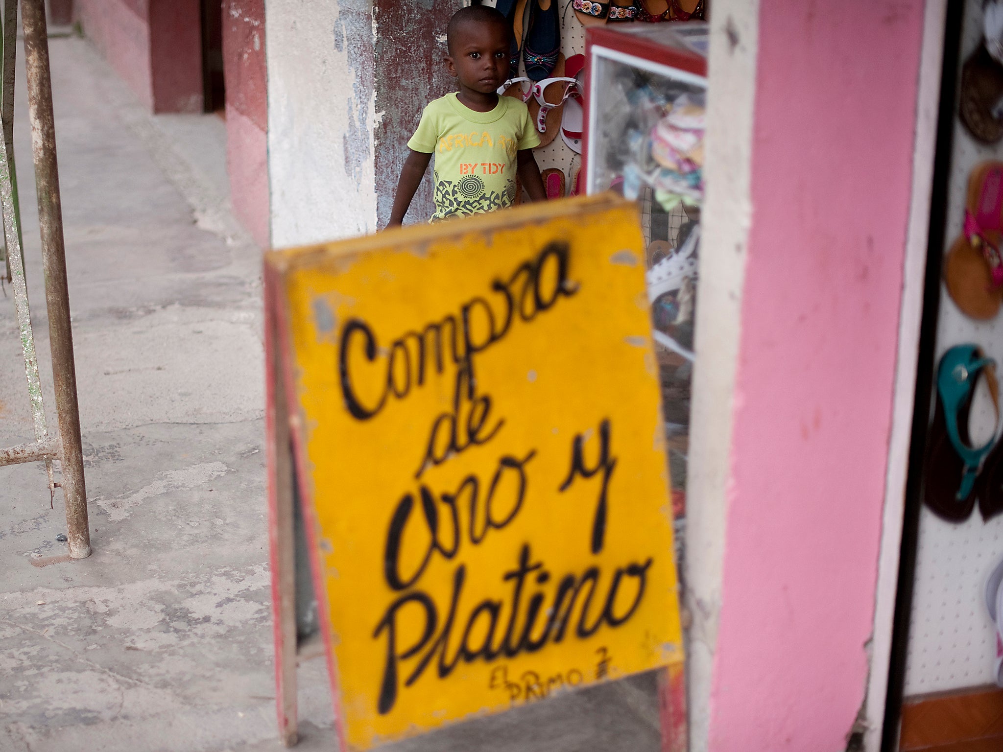 ‘We buy gold and platinum’, one of many shop signs reads in downtown Tado Choco, Colombia