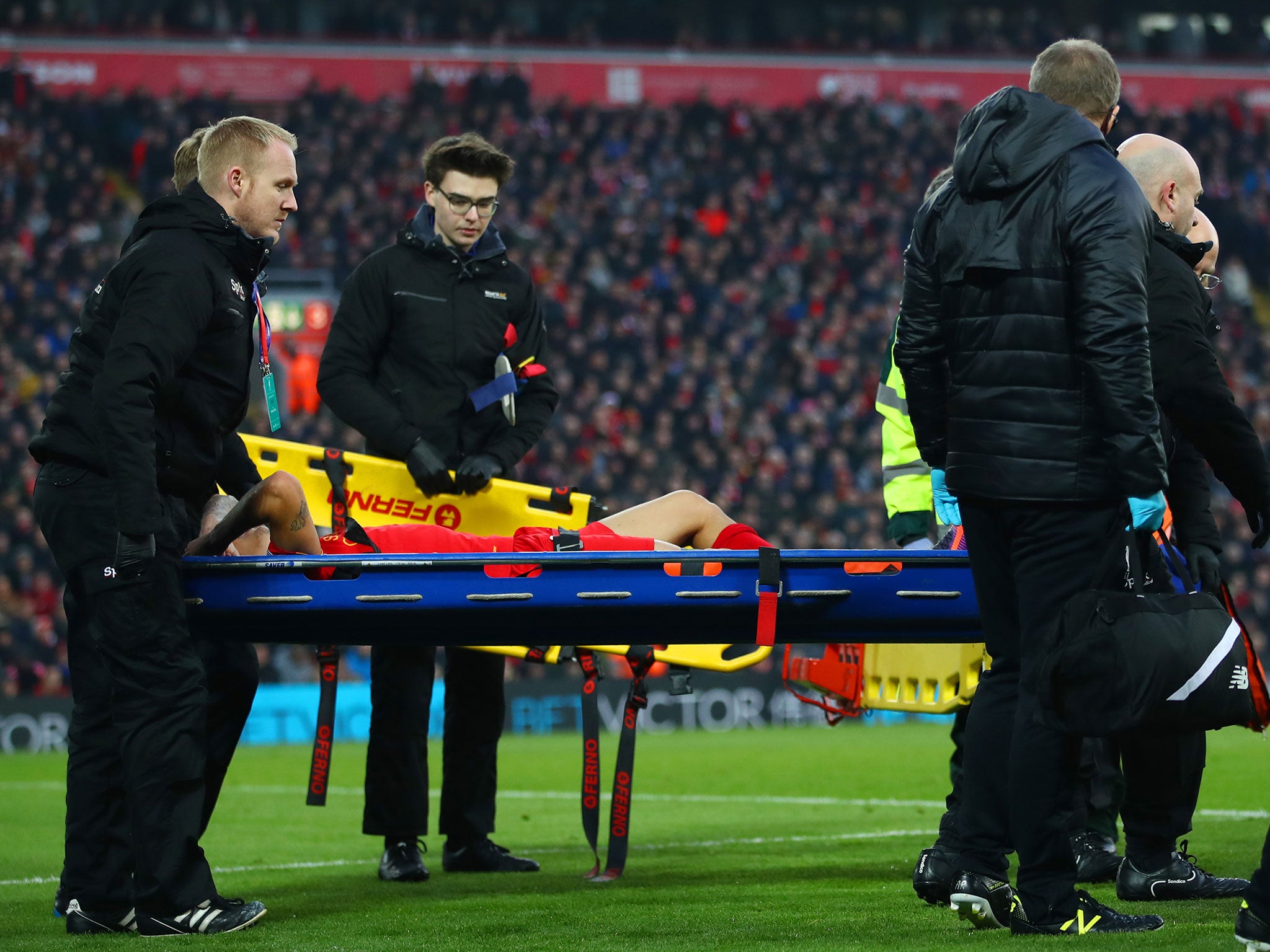 Coutinho is stretched off during Saturday's game against Sunderland after clashing with Didier Ndong