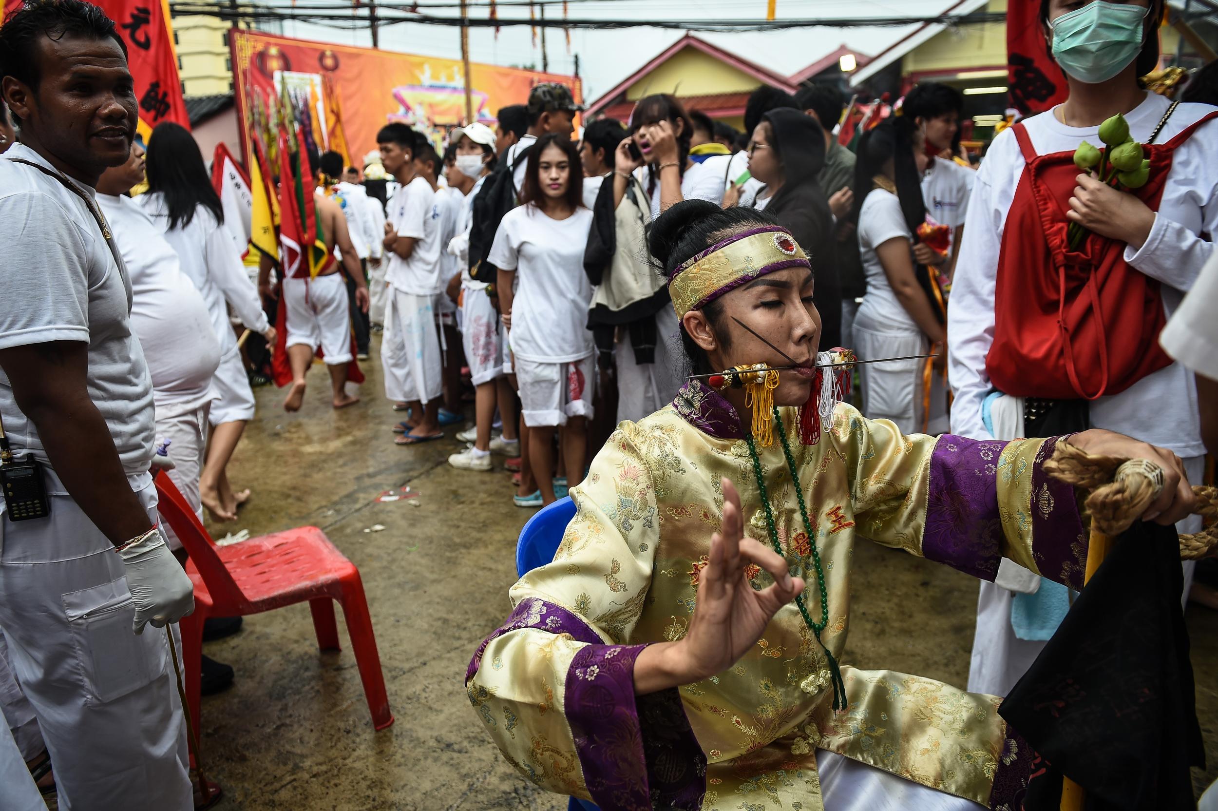 Participants sink into a trance before skewering their faces