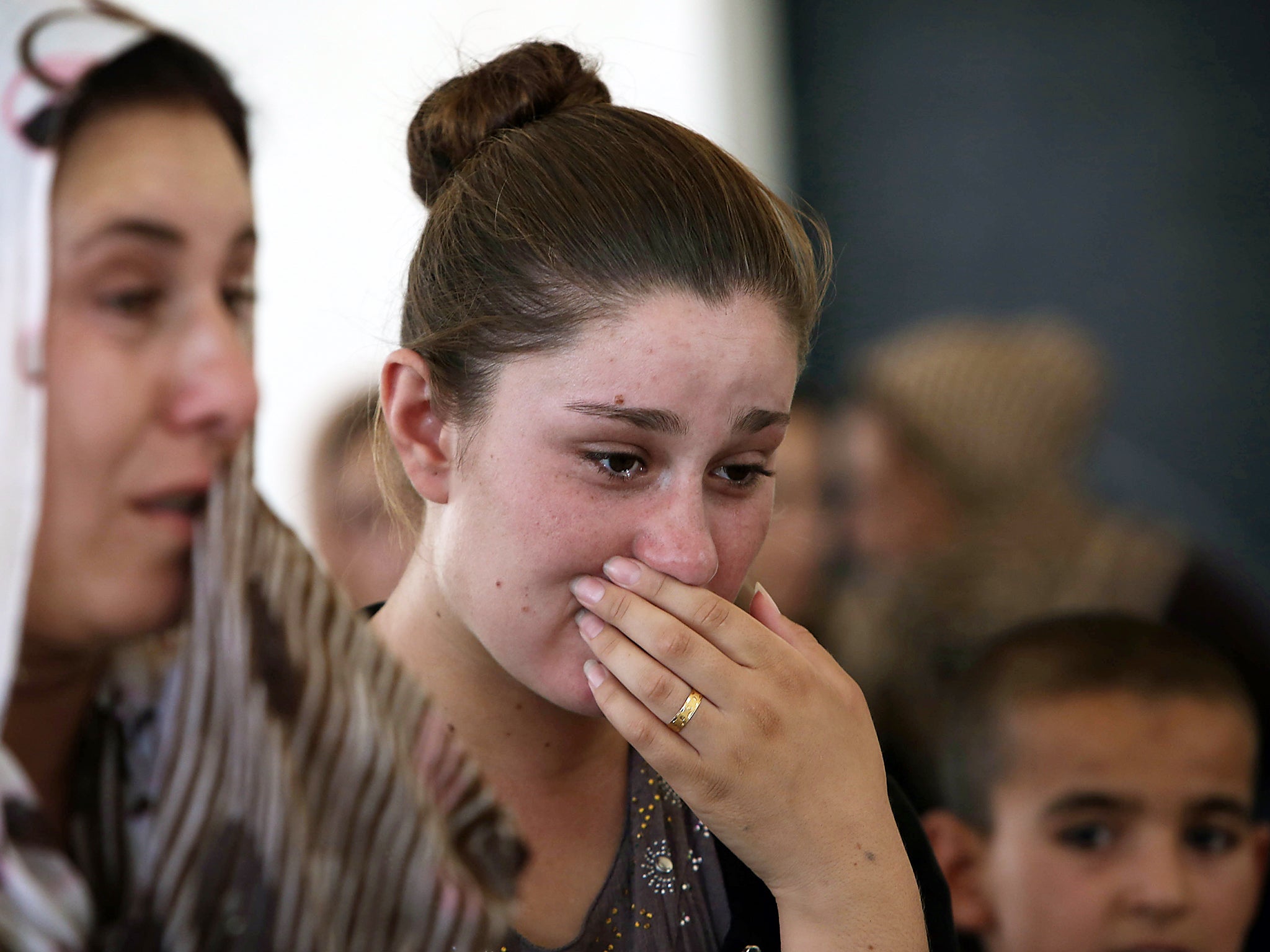 A Yazidi woman takes shelter in a school in Iraq’s Kurdish region after fleeing when Isis attacked the town of Sinjar in 2014, enslaving and killing hundreds