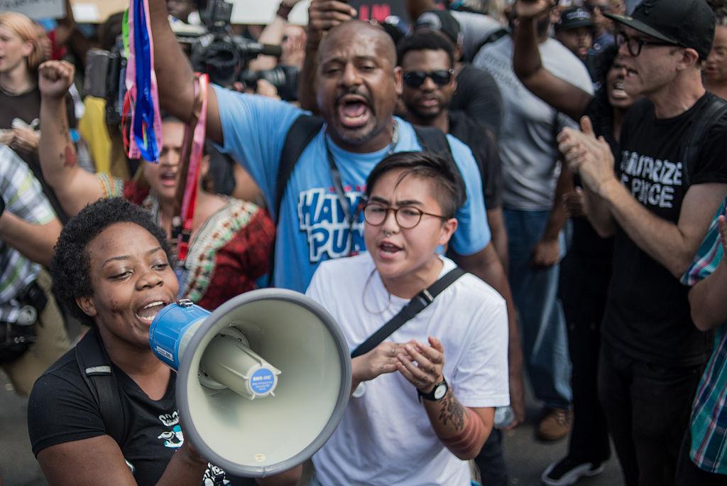 Demonstrators protest outside of Bank of America Stadium before an NFL football game between the Charlotte Panthers and the Minnesota Vikings September 25, 2016 in Charlotte, North Carolina. Protests have disrupted the city since Tuesday night following the shooting of 43-year-old Keith Lamont Scott at an apartment complex near UNC Charlotte.