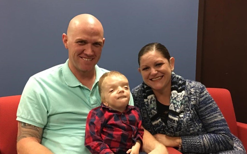 Grayson pictured with his father Kendyl and mother Jenny