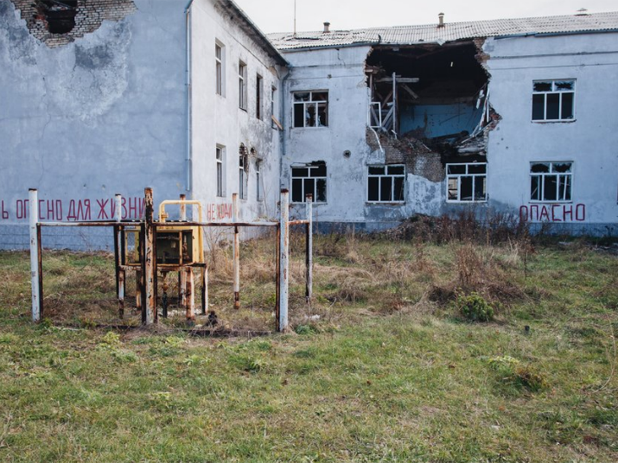 Buildings along the route lie in destruction after years of war