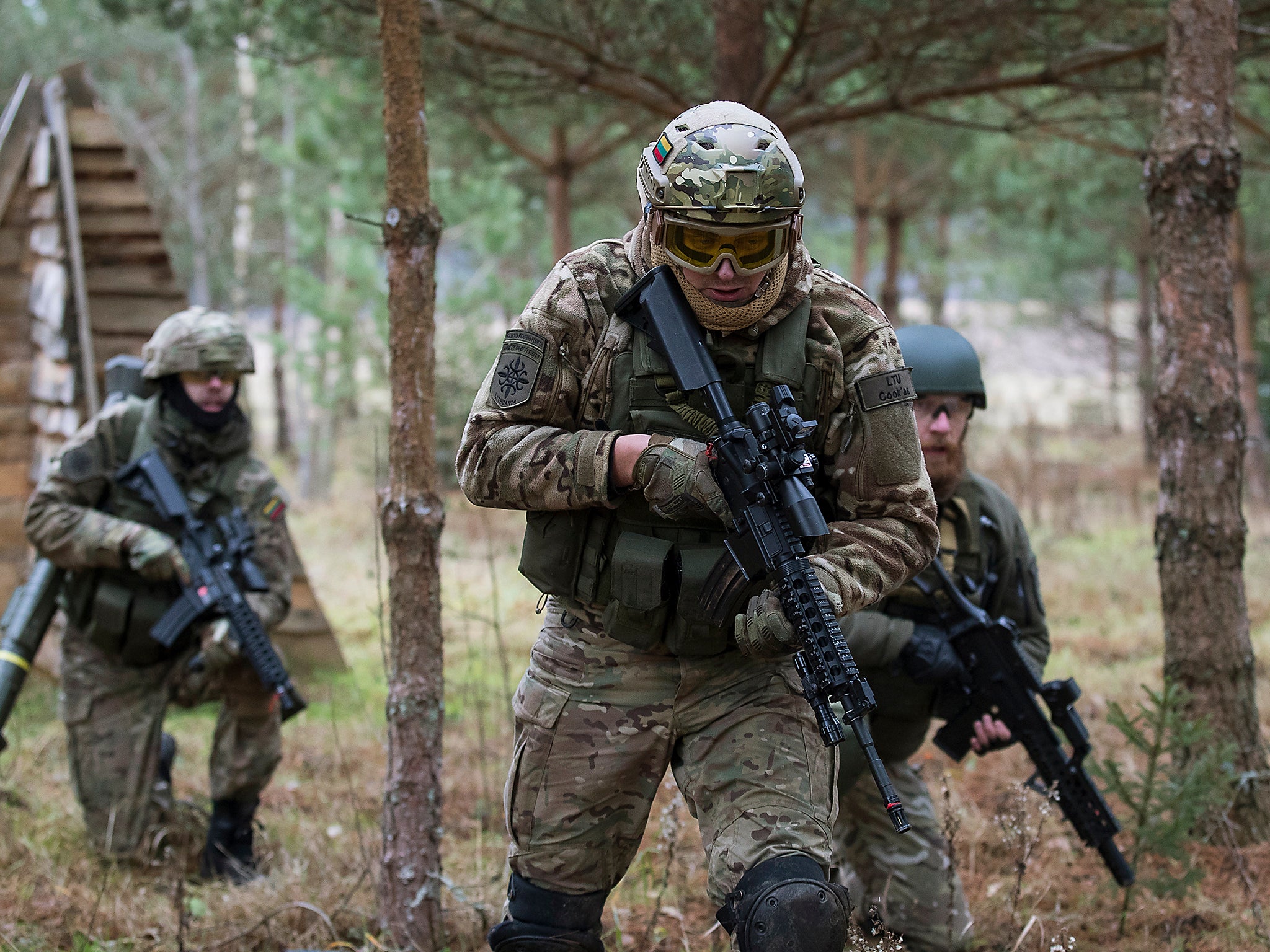 Young Lithuanian civilians in military fatigues practice insurgency tactics that they fear could be needed given Russia's resurgence, in the village of Pomarazai, some 25 km (15 miles) from the capital Vilnius, Lithuania