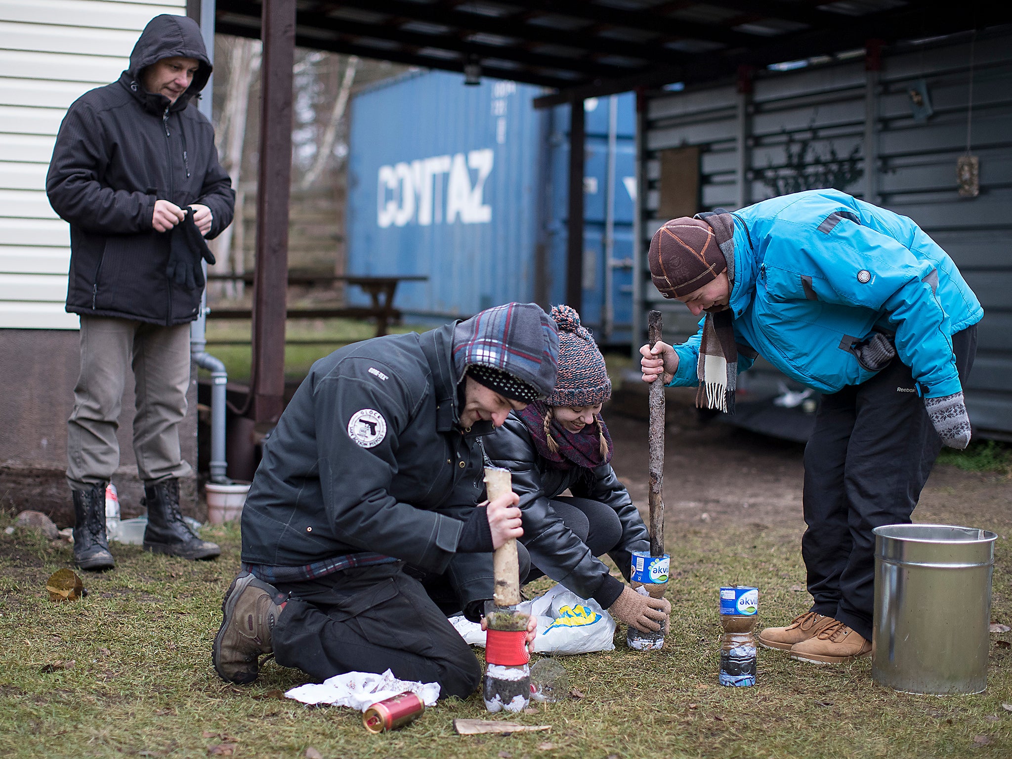 Lithuanian civilians learn how to filter dirty water during a survival course teaching them skills that some fear could be needed given Russia's resurgence, just outside of the capital Vilnius, Lithuania