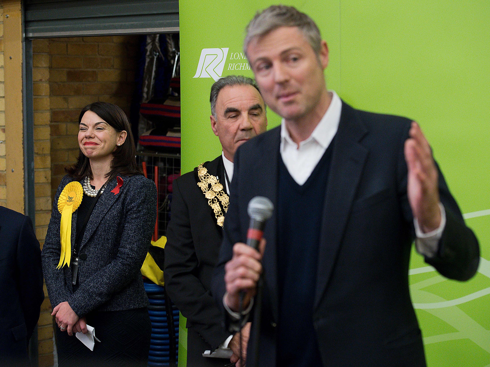 Newly elected Liberal Democrat MP for Richmond Park Sarah Olney listens to Independent candidate Zac Goldsmith speaking after Olney won her seat in Richmond, south-west London