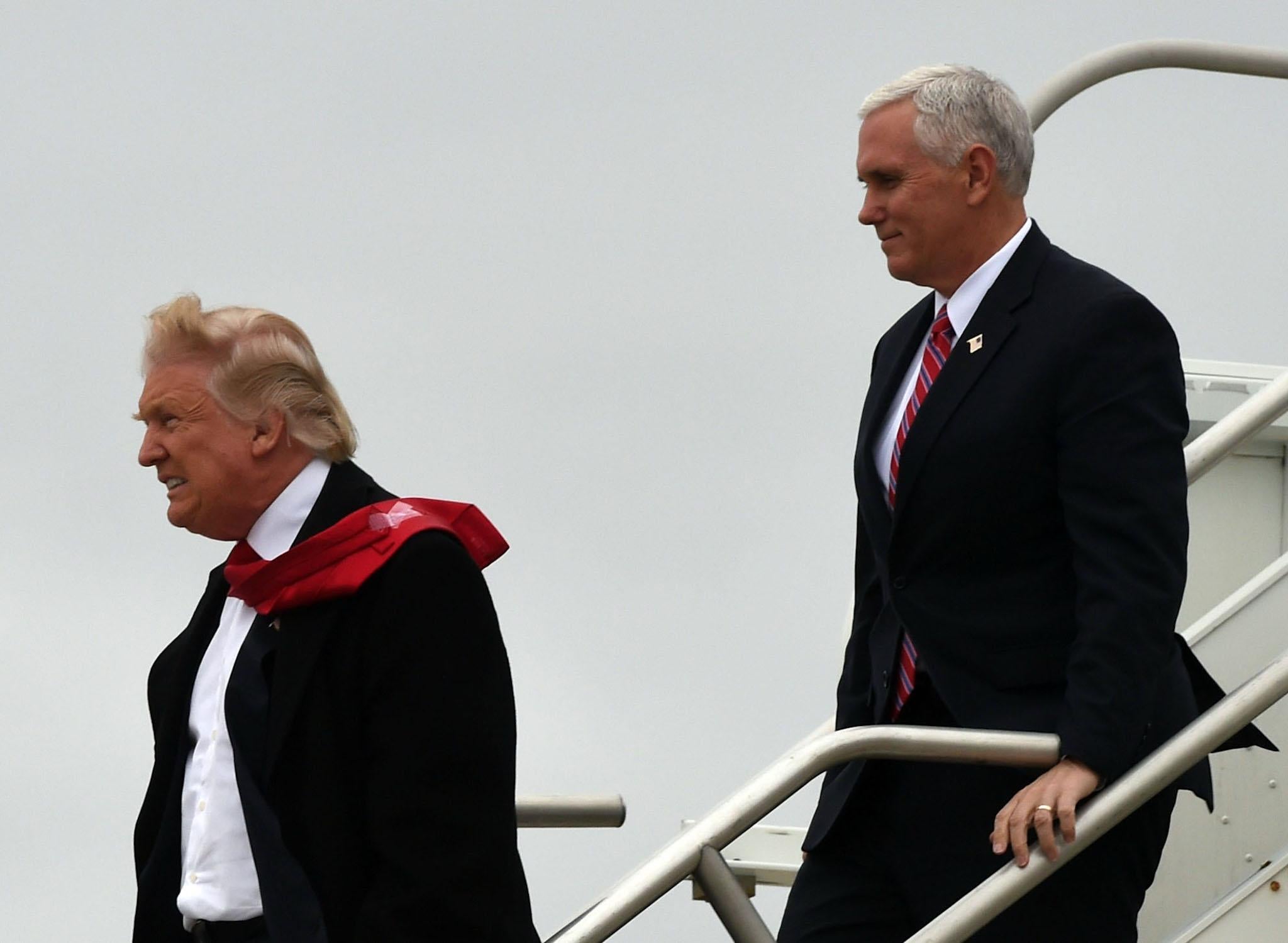 President-elect Donald Trump and Vice President-elect Mike Pence arrive on December 1, 2016 at the airport before they go on to visit the Carrier air conditioning and heating company in Indianapolis, Indiana