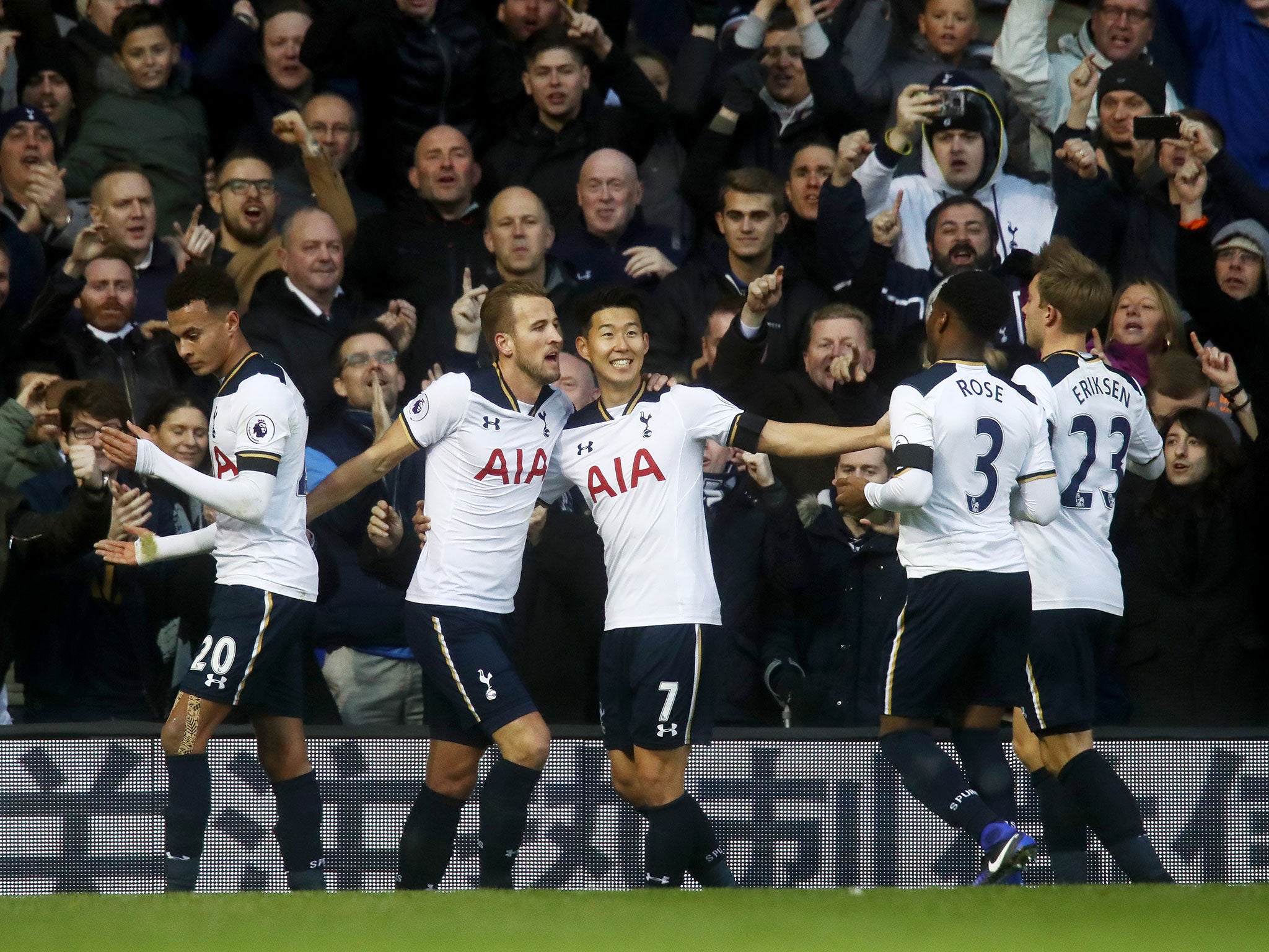 Son celebrates with his team-mates after scoring his side's second goal