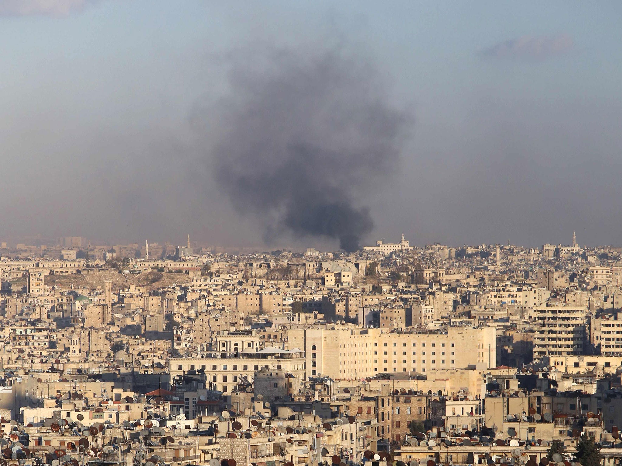 A general view taken from the government-held side of Aleppo shows smoke billowing during fighting between Syrian regime forces and rebel fighters in east Aleppo, on December 3, 2016. (AFP/Getty)