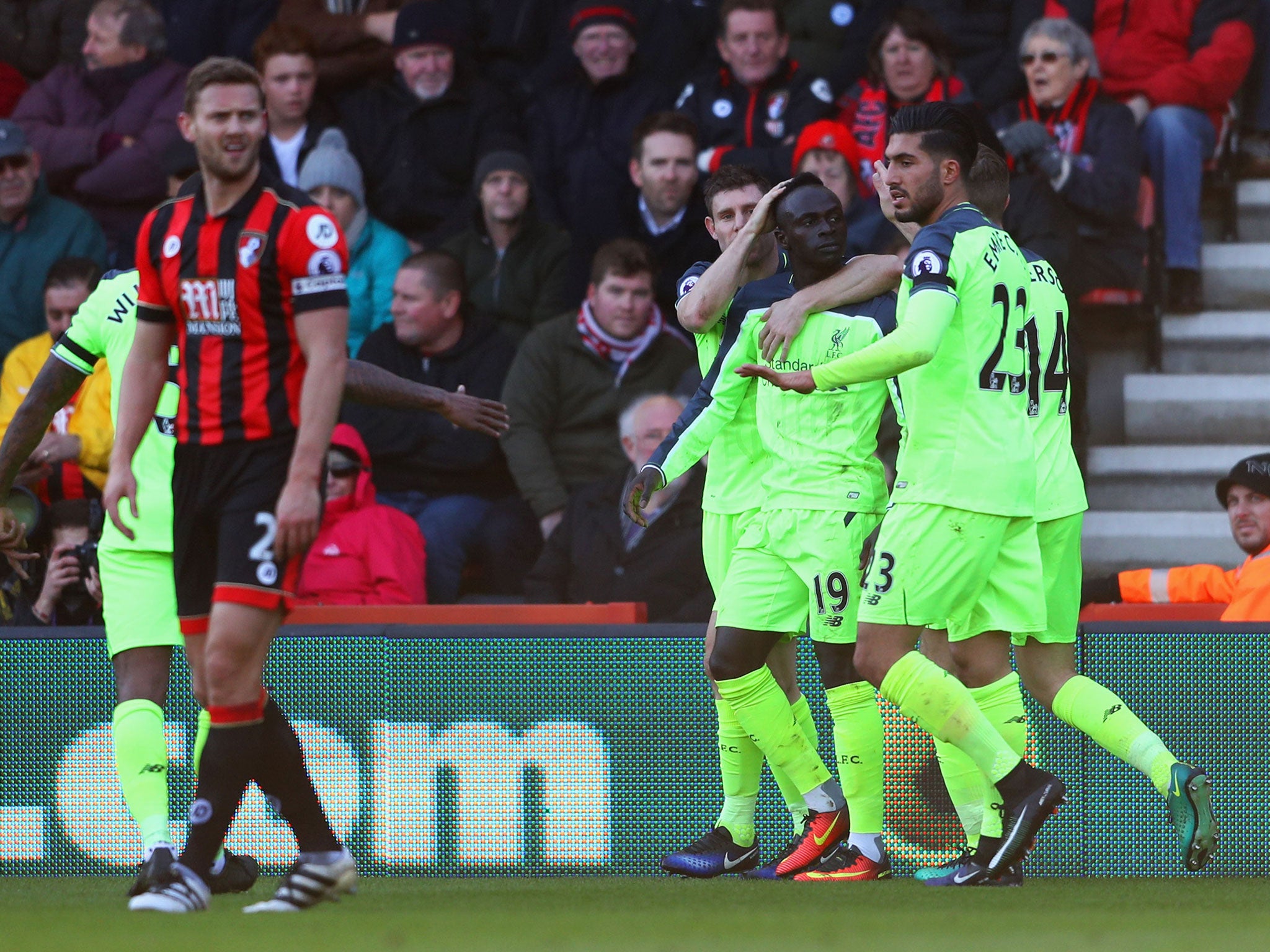 Sadio Mane celebrates with his team mates after scoring Liverpool's first goal