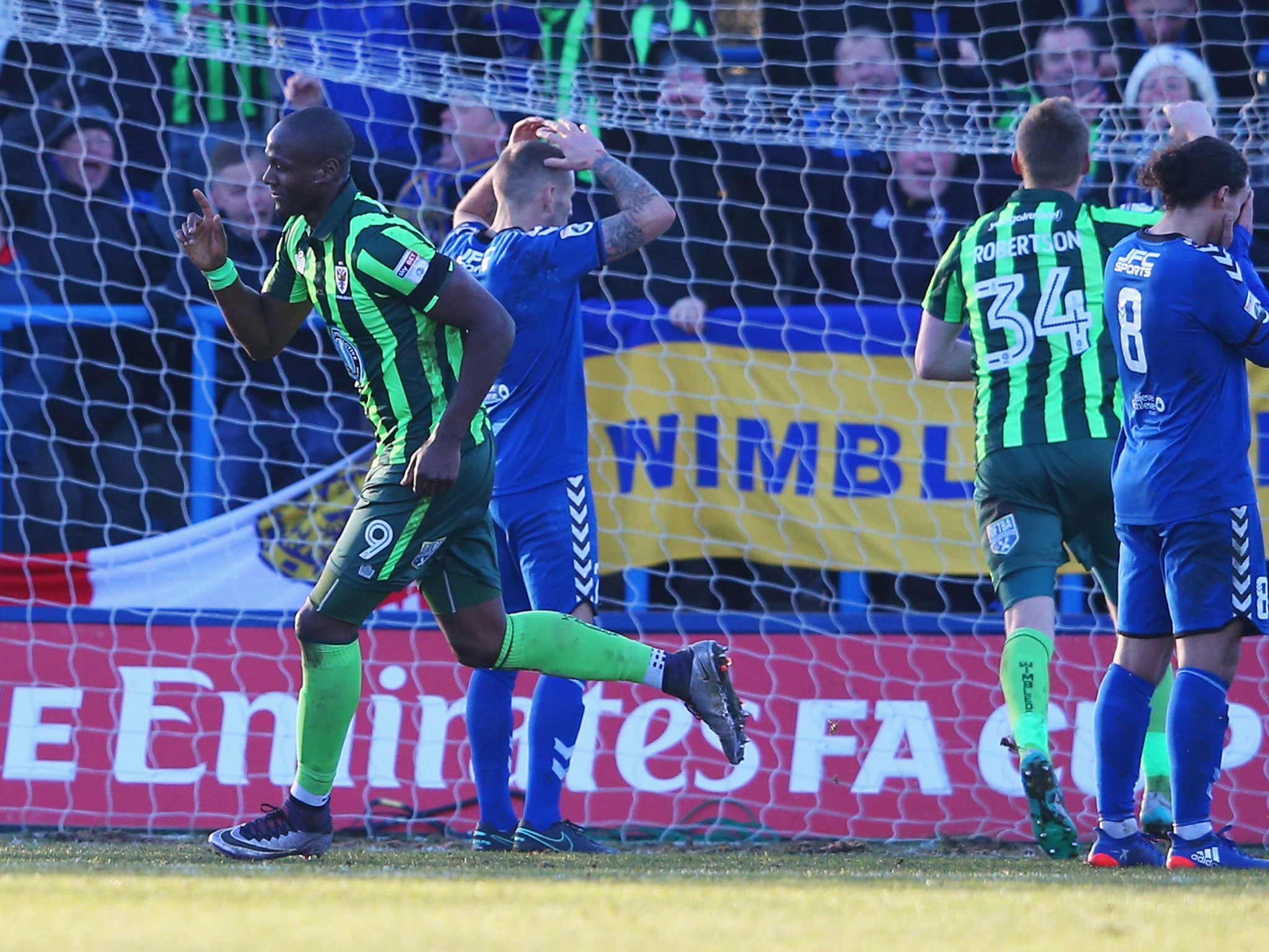 Tom Elliott celebrates his winning goal for Wimbledon