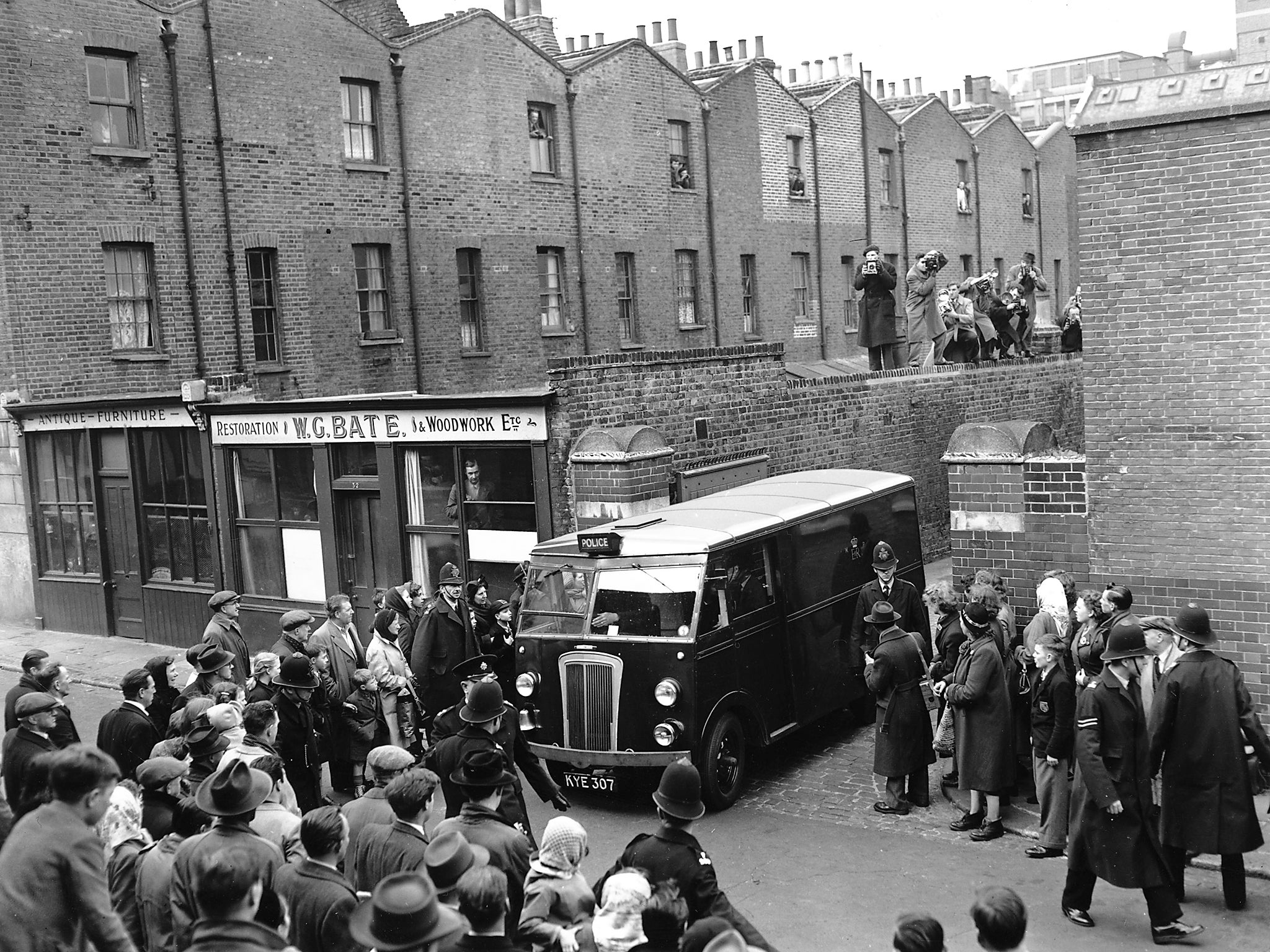 John Christie (1898 - 1953) leaving court in a police van after the trial accusing him of his wife's murder at 10 Rillington Place. He was later convicted of six murders including Ethel Christie and hanged in 1953