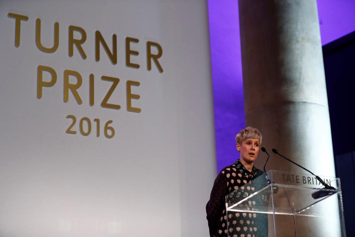 Helen Marten accepts her prize at the Tate Gallery in London (Reuters)