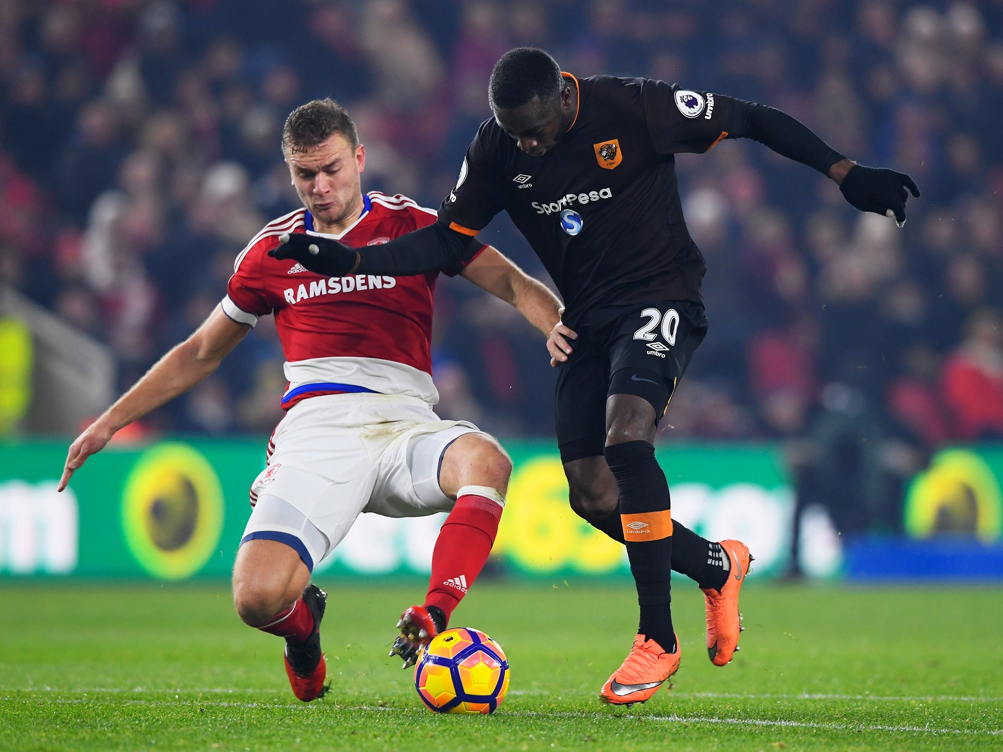 Middlesbrough's Gibson gets a foot in on Diomande