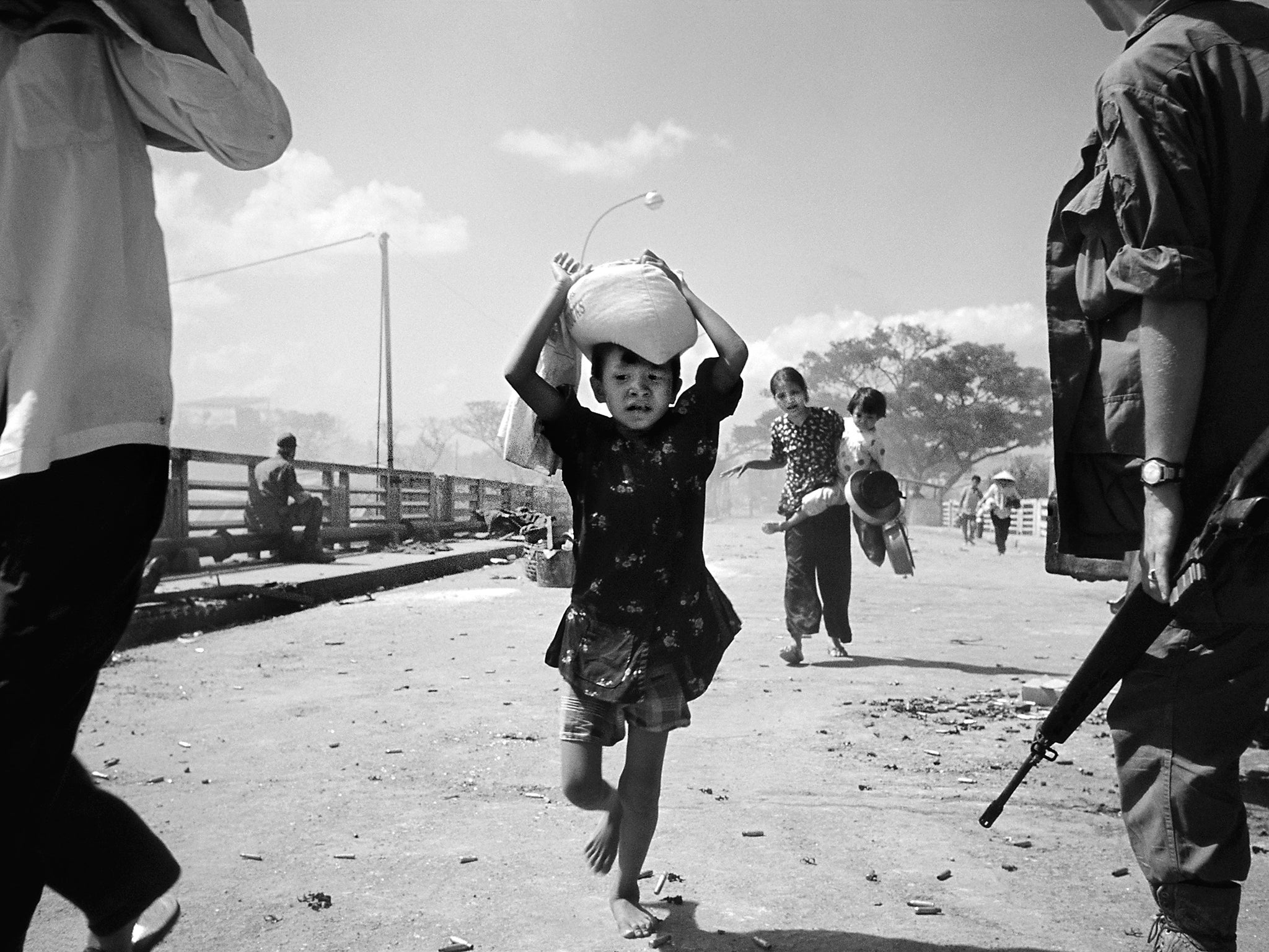 Children run to safety during the battle for Saigon during the Vietnam War (Philip Jones Griffiths/Magnum)