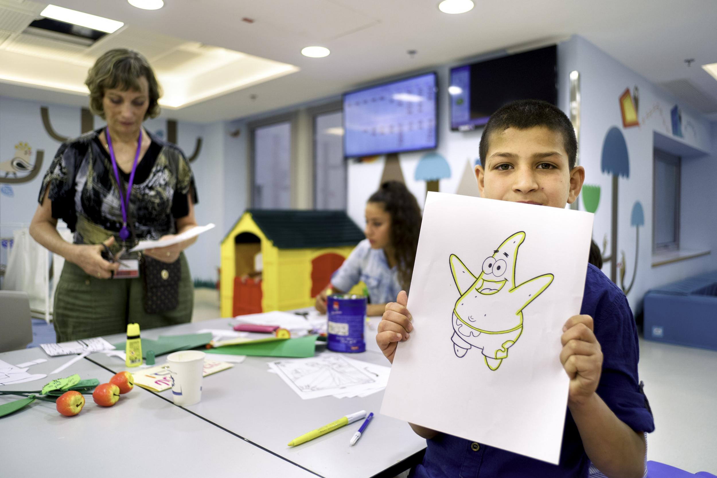 Colouring in seemed a popular activity among the children - by Alan Schaller