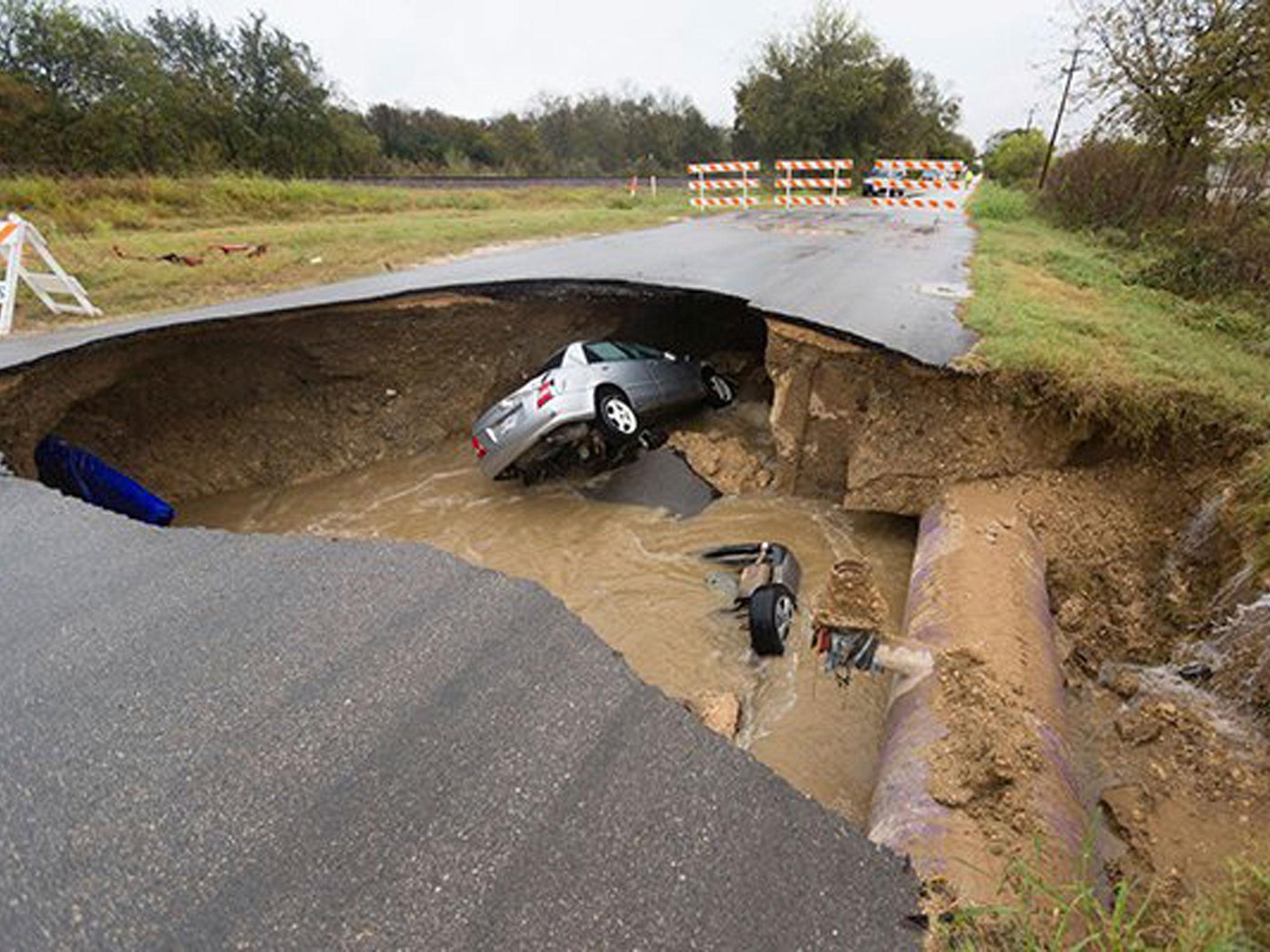 Utility officials say the sinkhole appeared after a sewer line ruptured during heavy rain