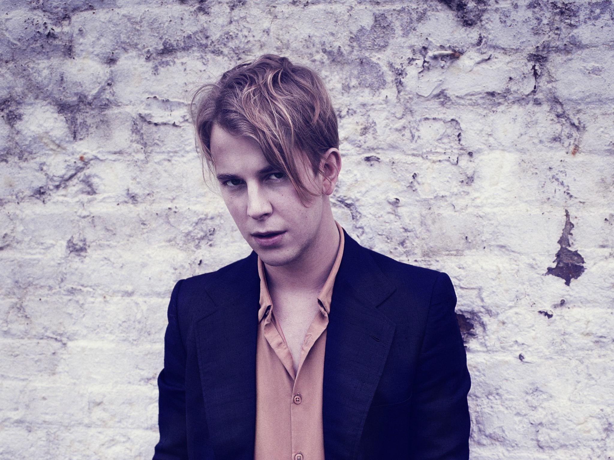 Tom Odell has been compared to David Bowie by Lily Allen because of his charisma on stage