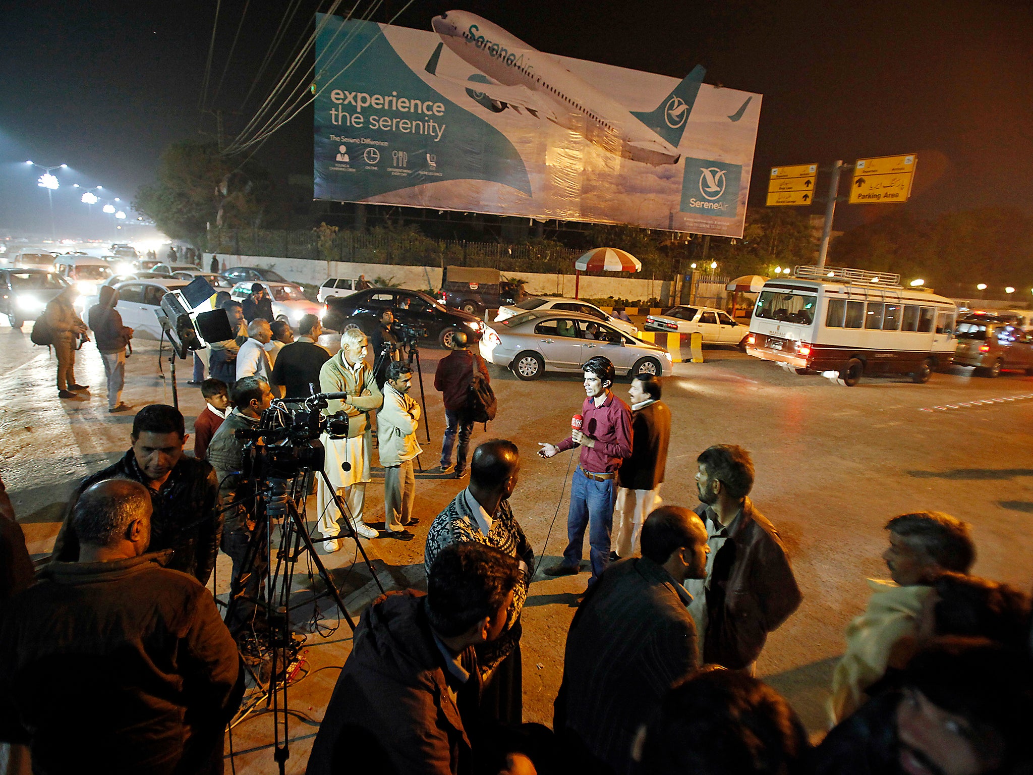 Pakistani media and others gathered at Benazir Bhutto International Airport following a report that a passenger plane taking off from Chitral, in the country's north, had crashed near a village near the town of Havelian