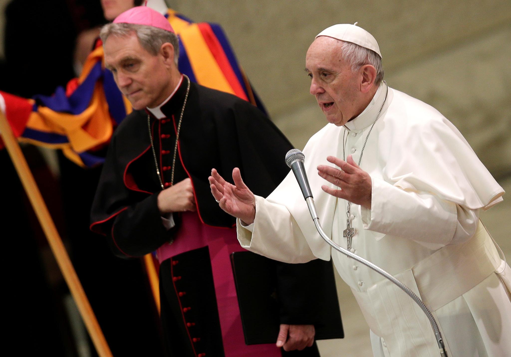 Pope Francis talks as he leads the general audience in Paul VI Hall at the Vatican December 7, 2016