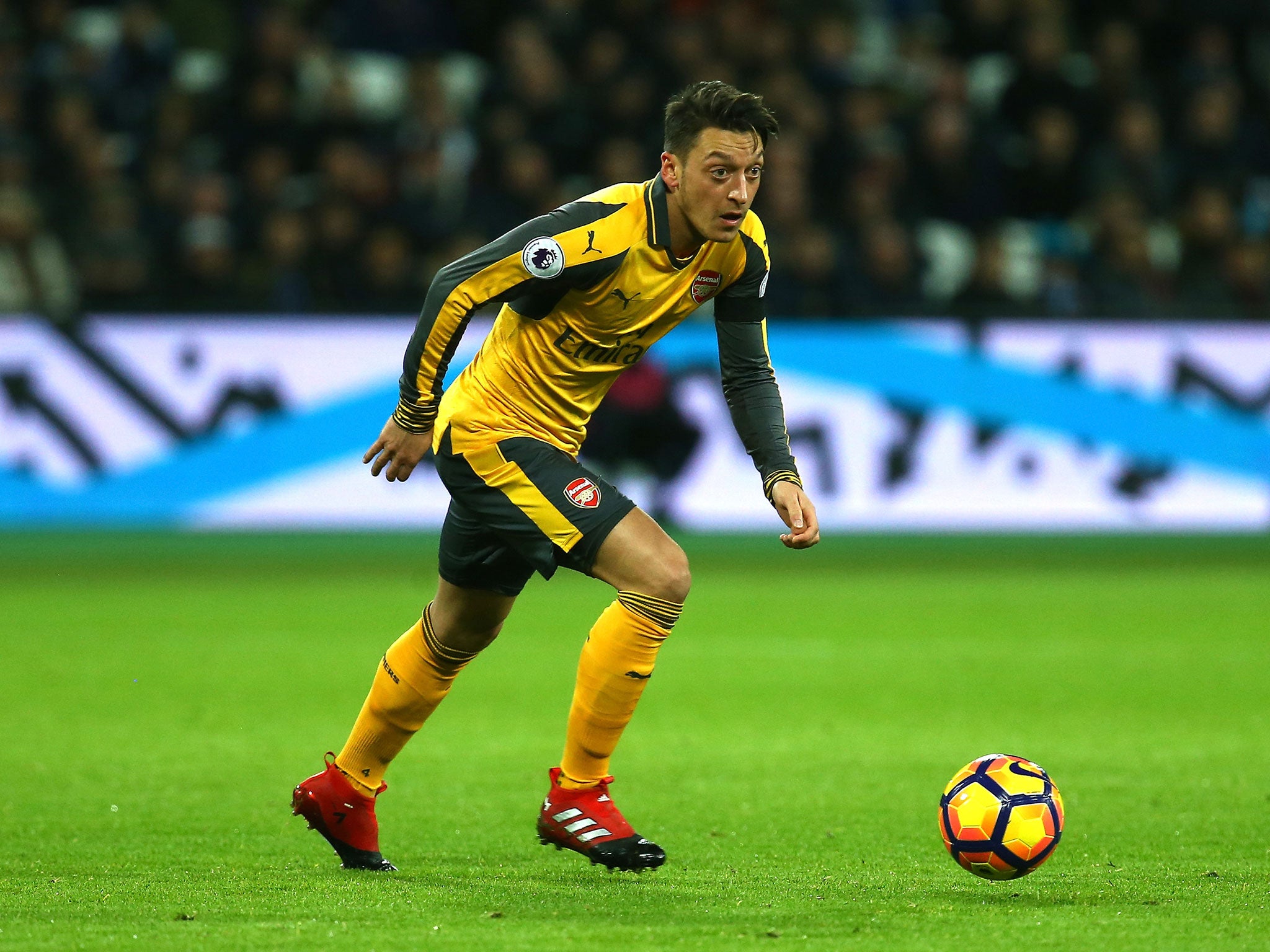 Mesut Ozil in action for Arsenal against West Ham