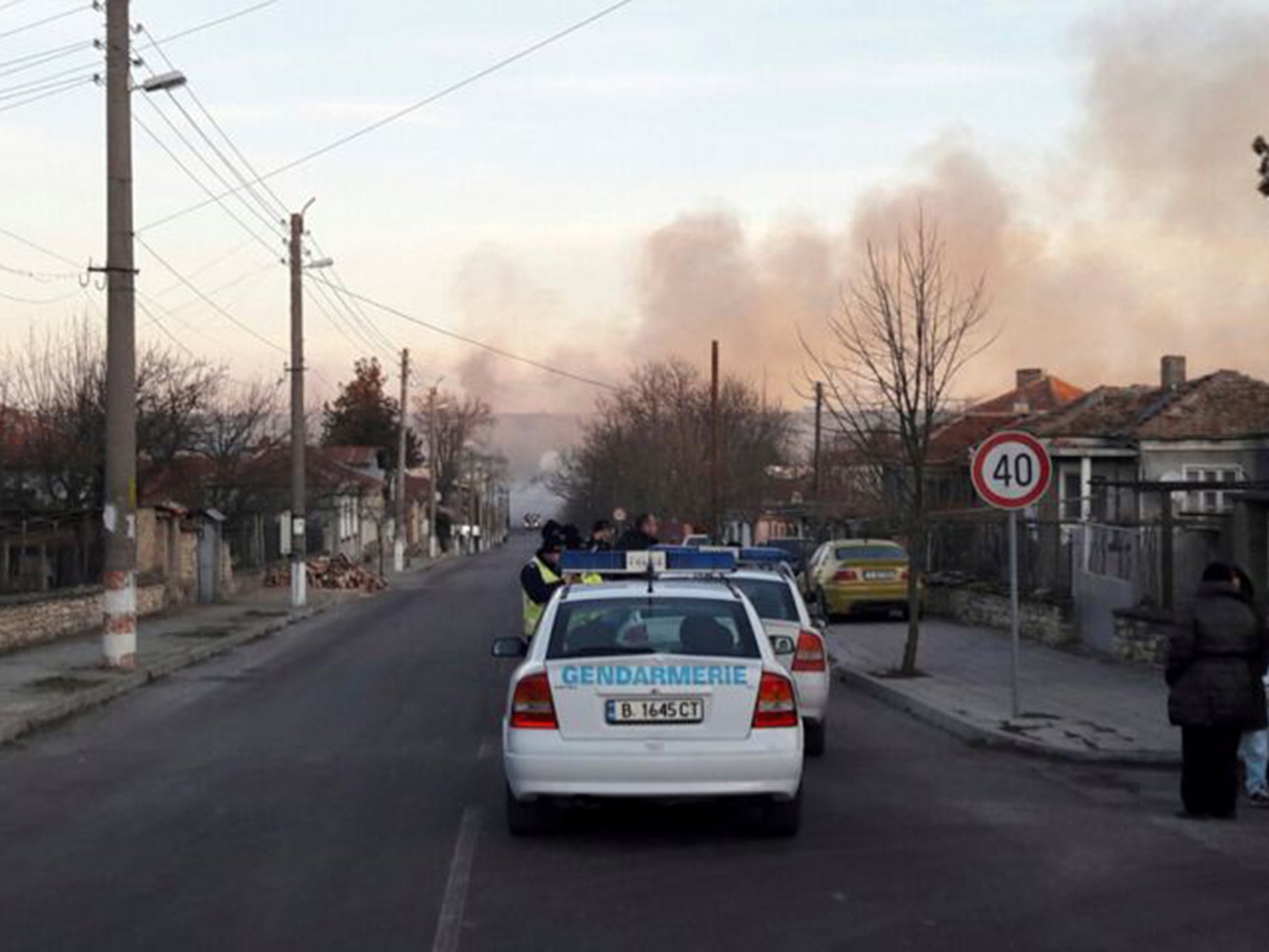 Smoke rises after a cargo train derailed and exploded in the village of Hitrino, Bulgaria