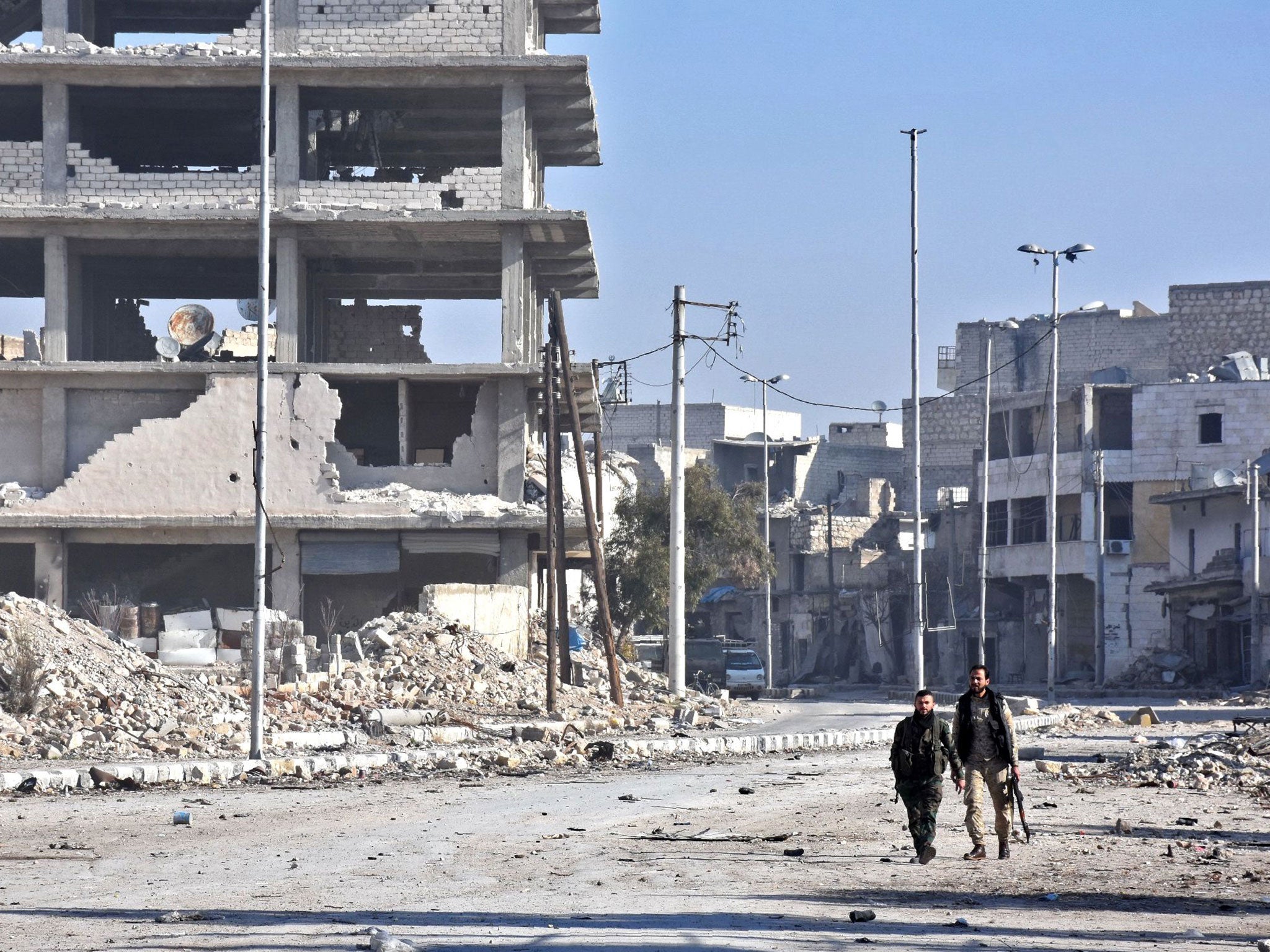 Syrian pro-government forces patrol Marja Square area of Aleppo on 10 December