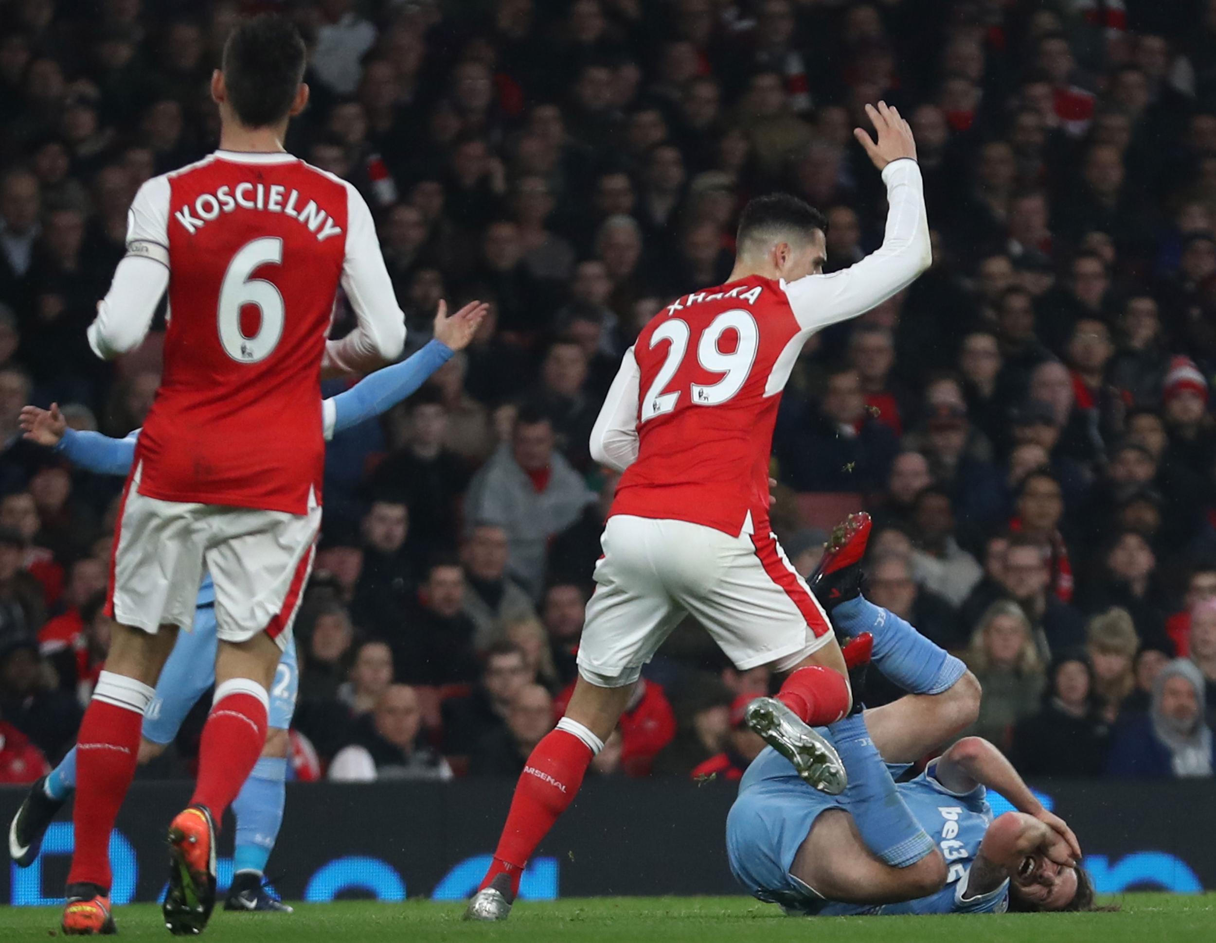 Granit Xhaka catches Joe Allen with an elbow to give away a penalty